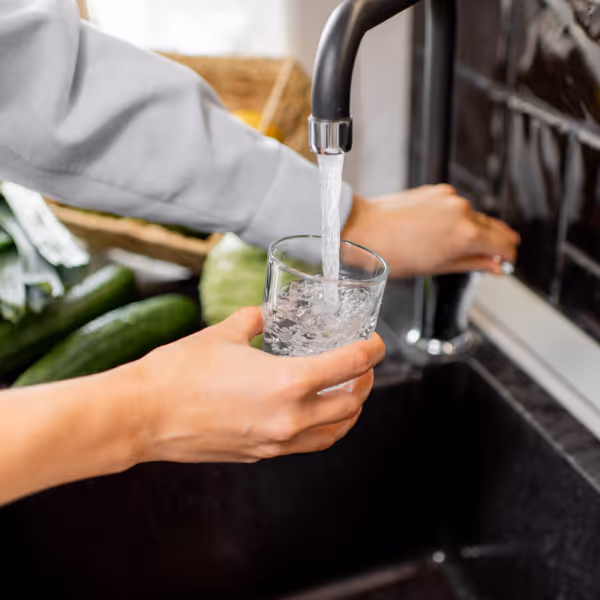 Filling up water from the sink after water treatment. 