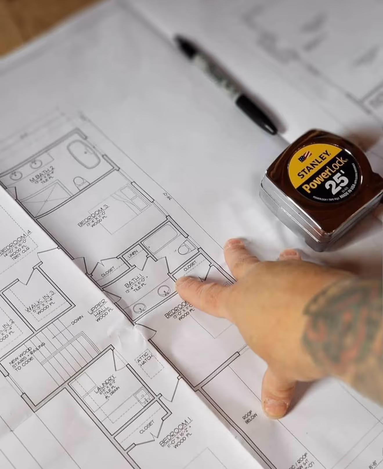 Our team reviewing blueprints prior to starting the project.