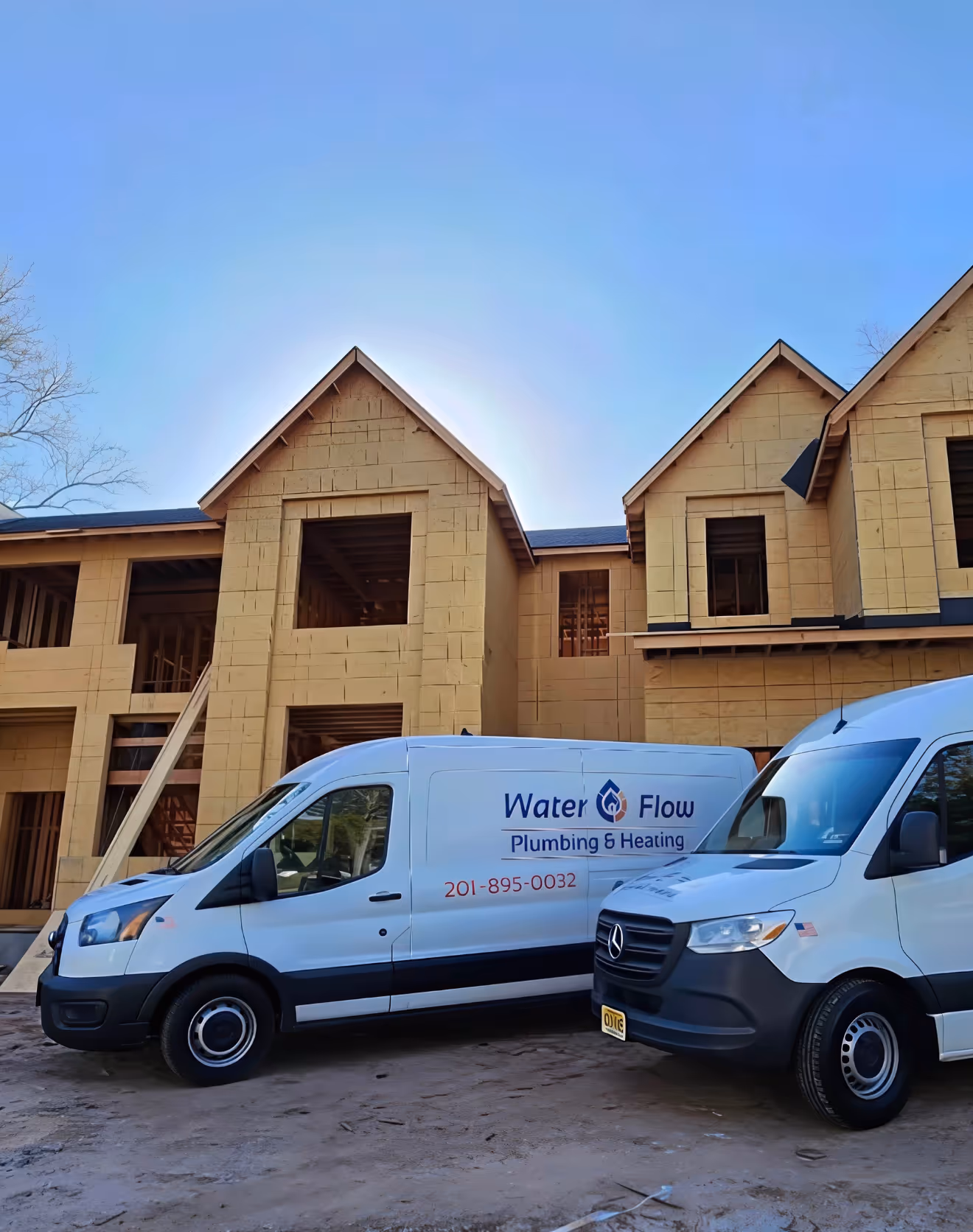 Our trucks parked outside new construction project during walkthrough.