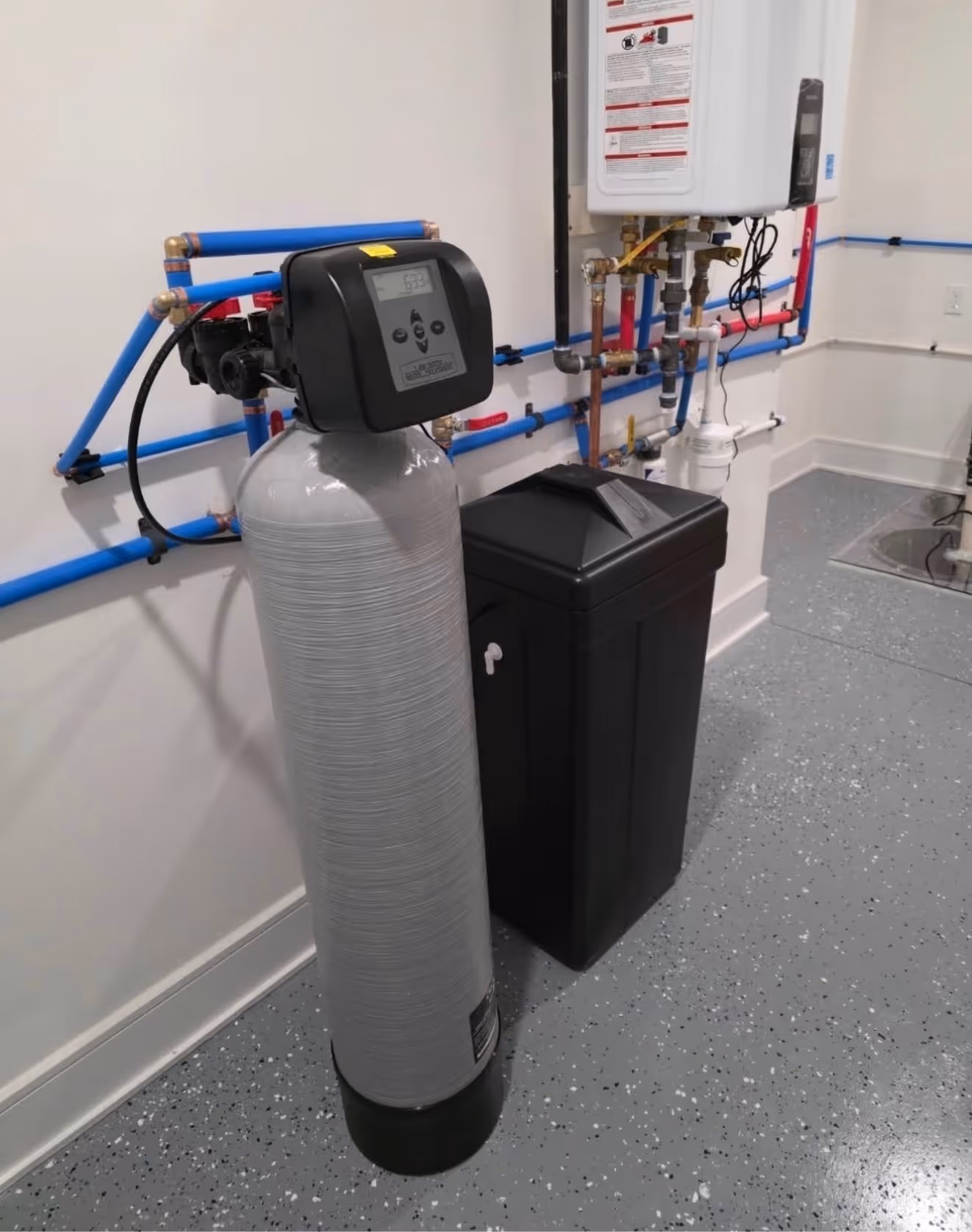 An installed water softener and water filtration system in an NJ home.