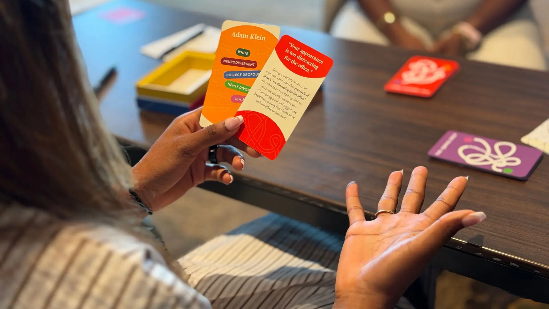 Woman looking at her Identity and Scenario cards