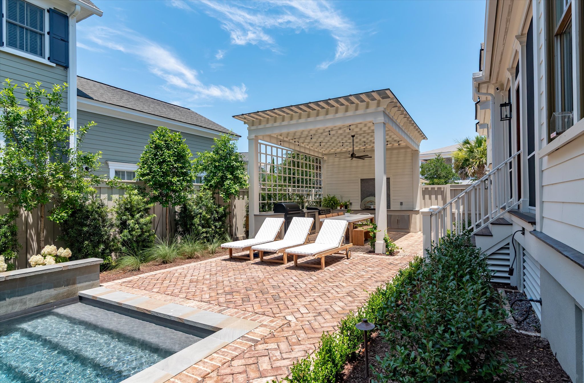 Custom outdoor living rereaet with pool and cabana area - BuiltByR3