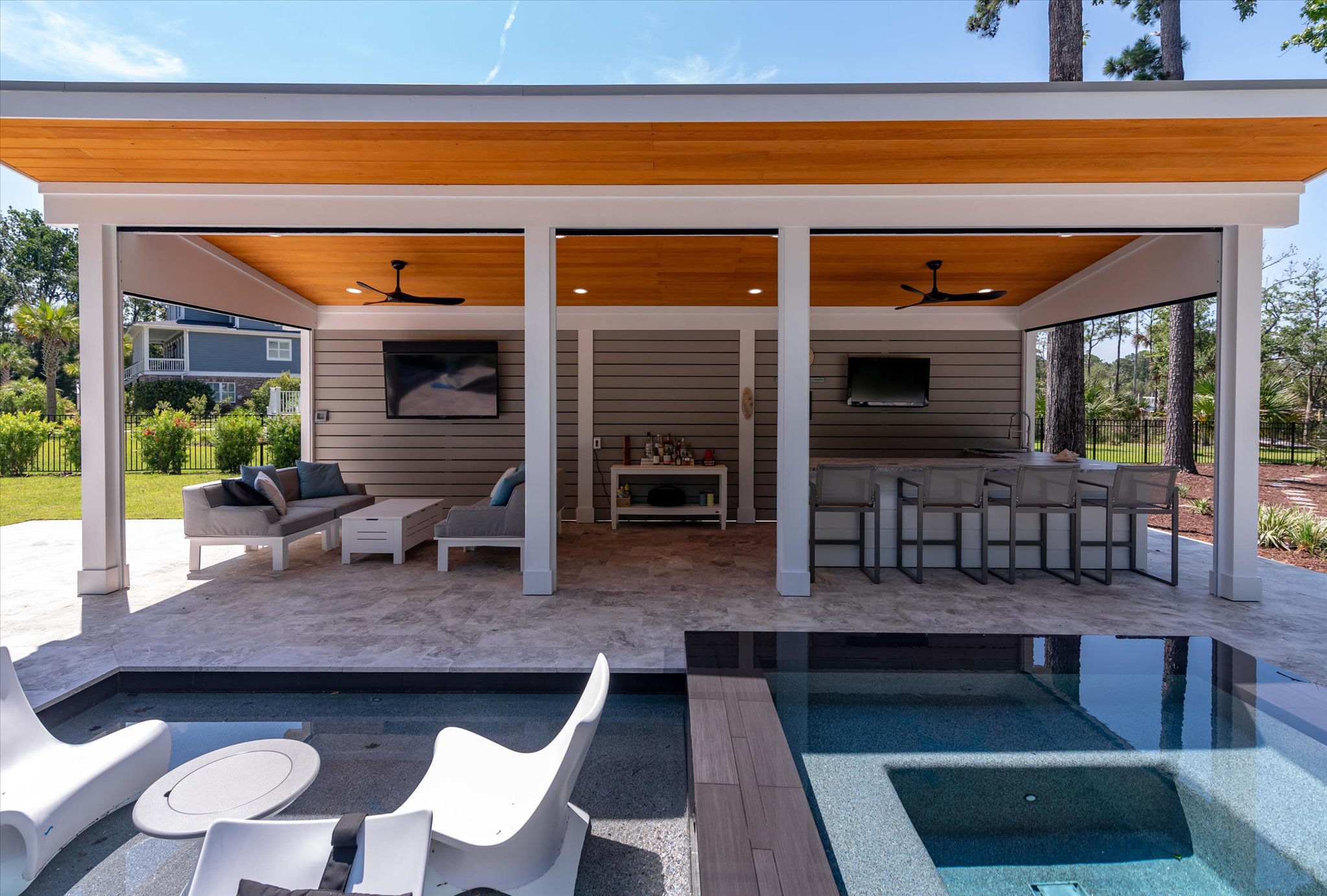 Cabana interior and pool area, custom outdoor living space in Goose Creek, SC - BuiltByR3