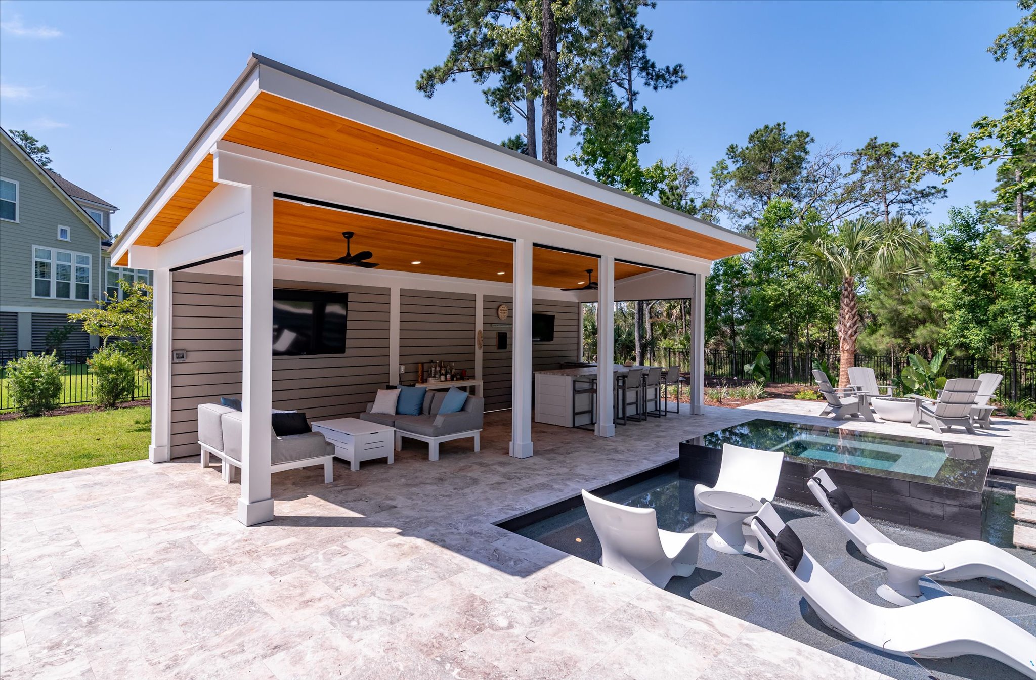 Image of cabana and lounge chairs by pool - Image of outdoor custom space in Goose Creek, SC - BuiltByR3