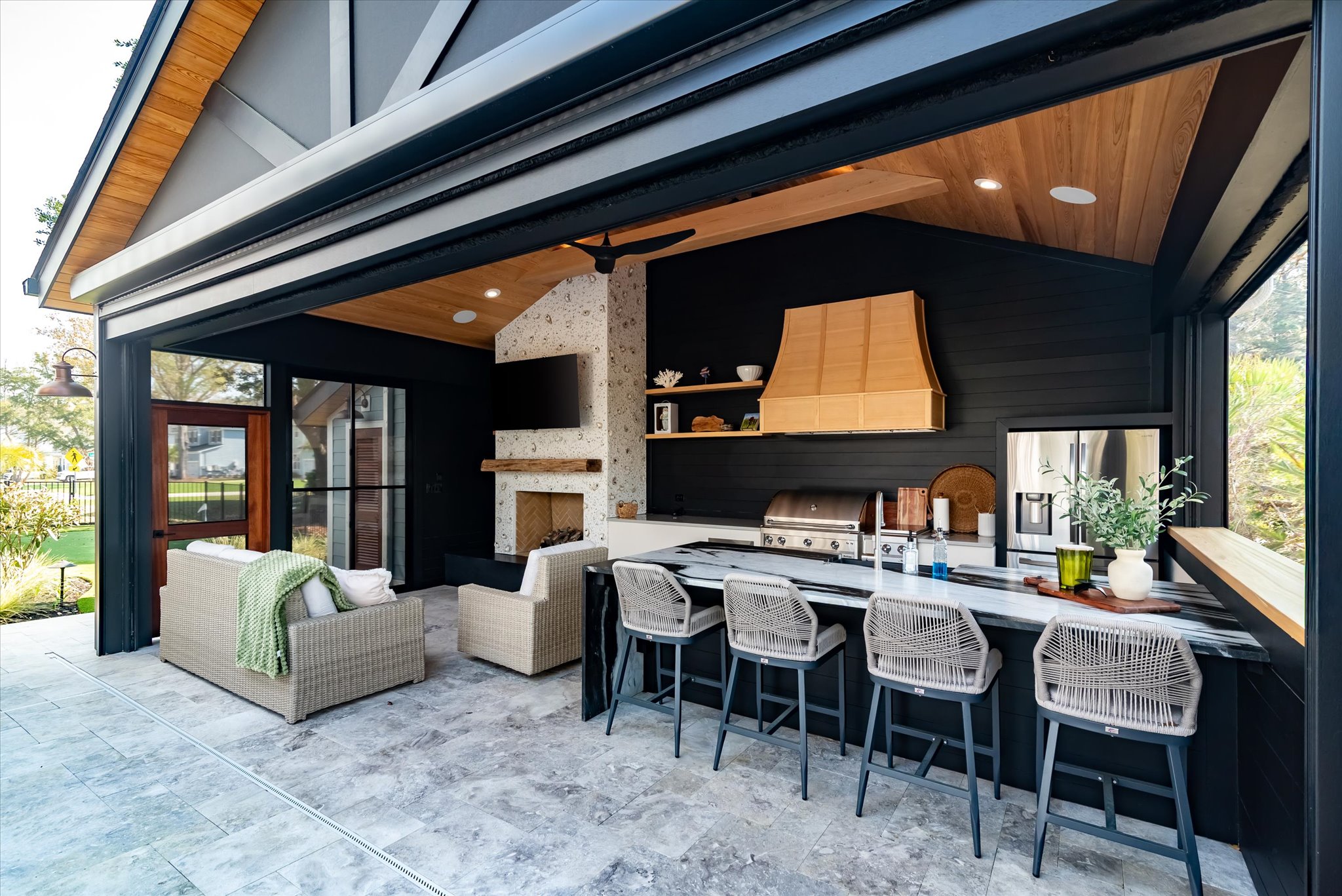 covered outdoor cabana in South Carolina with fireplace and kitchen - BuiltBy3