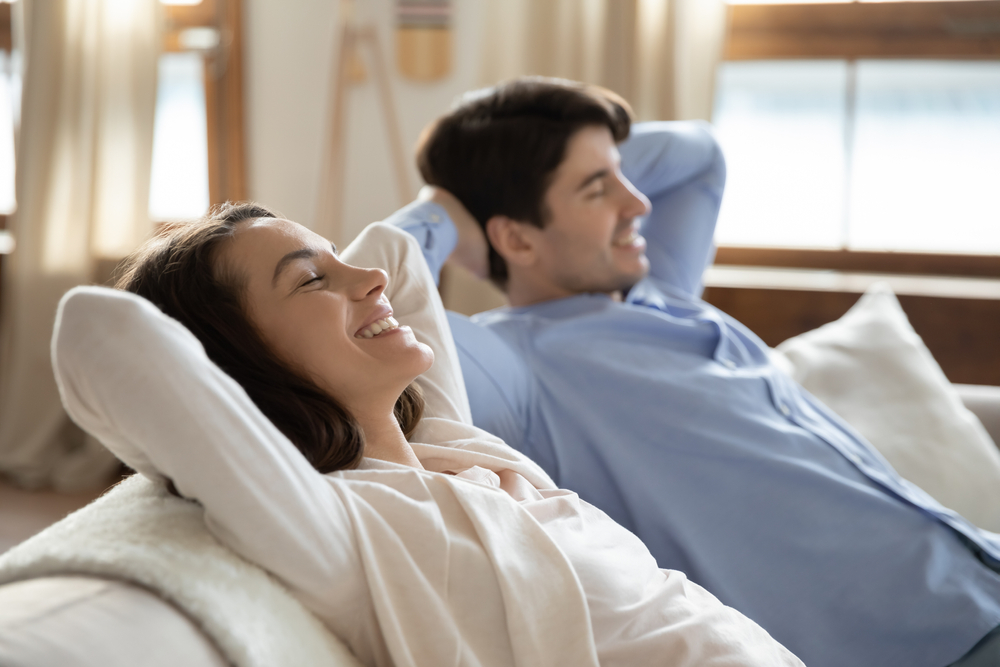 Couple relaxing on the couch together
