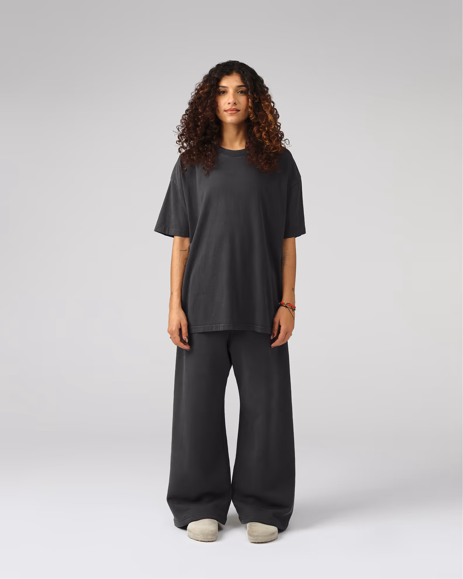 A contemporary streetwear silhouette with wider proportions for distinctive presence. Created from our proprietary BioCircular™ Jersey fabric, blending recycled and organic cotton for minimized impact.