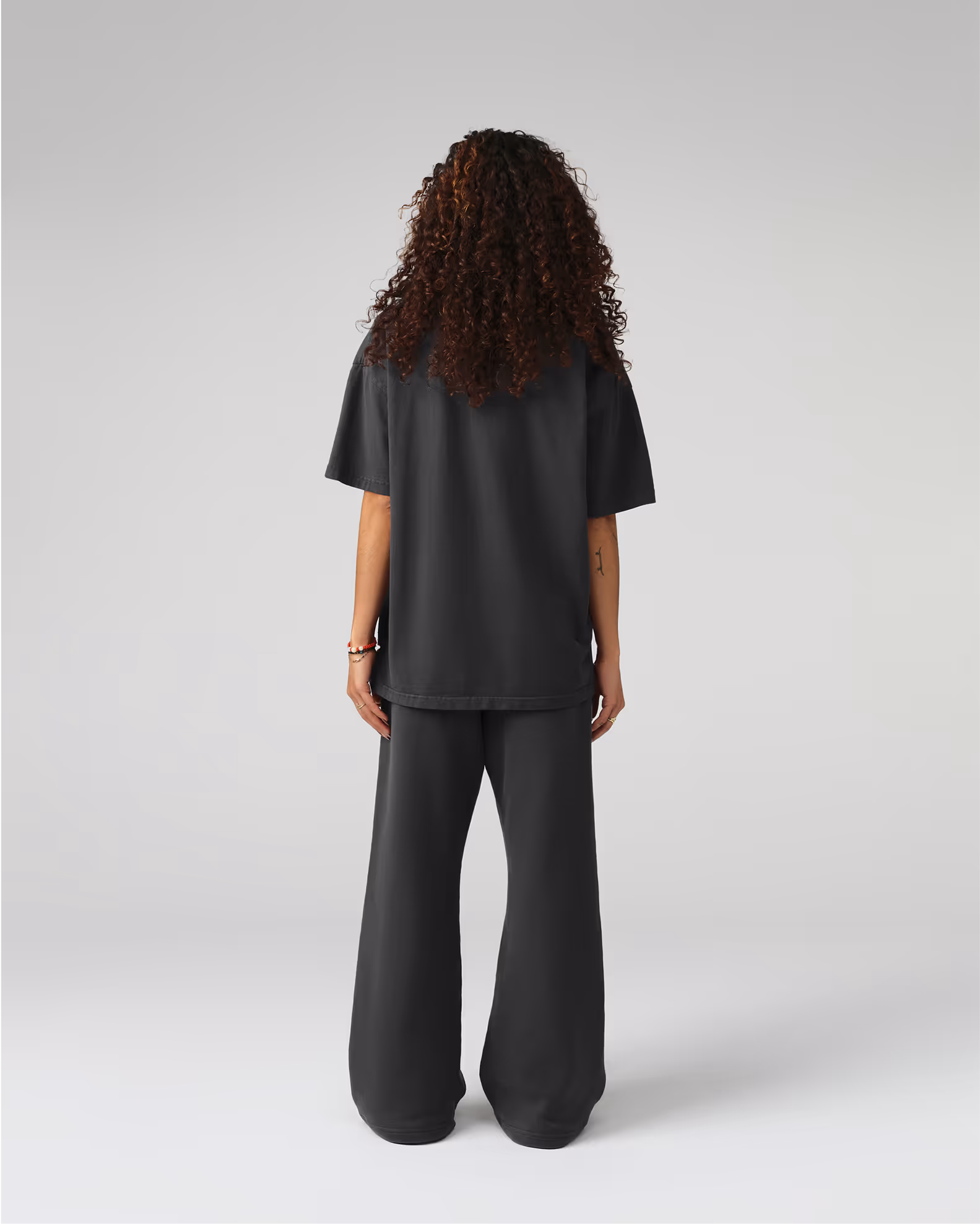 A contemporary streetwear silhouette with wider proportions for distinctive presence. Created from our proprietary BioCircular™ Jersey fabric, blending recycled and organic cotton for minimized impact.