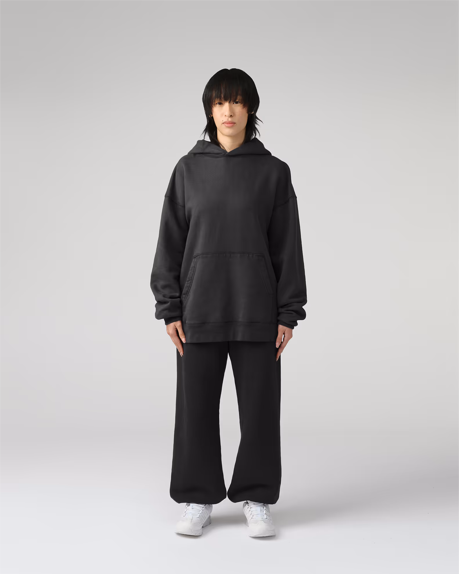 The definitive hoodie silhouette with traditional kangaroo pocket and a modern, relaxed fit. Crafted from our heavyweight organic cotton brushed fleece with an enzyme finish for natural softness.