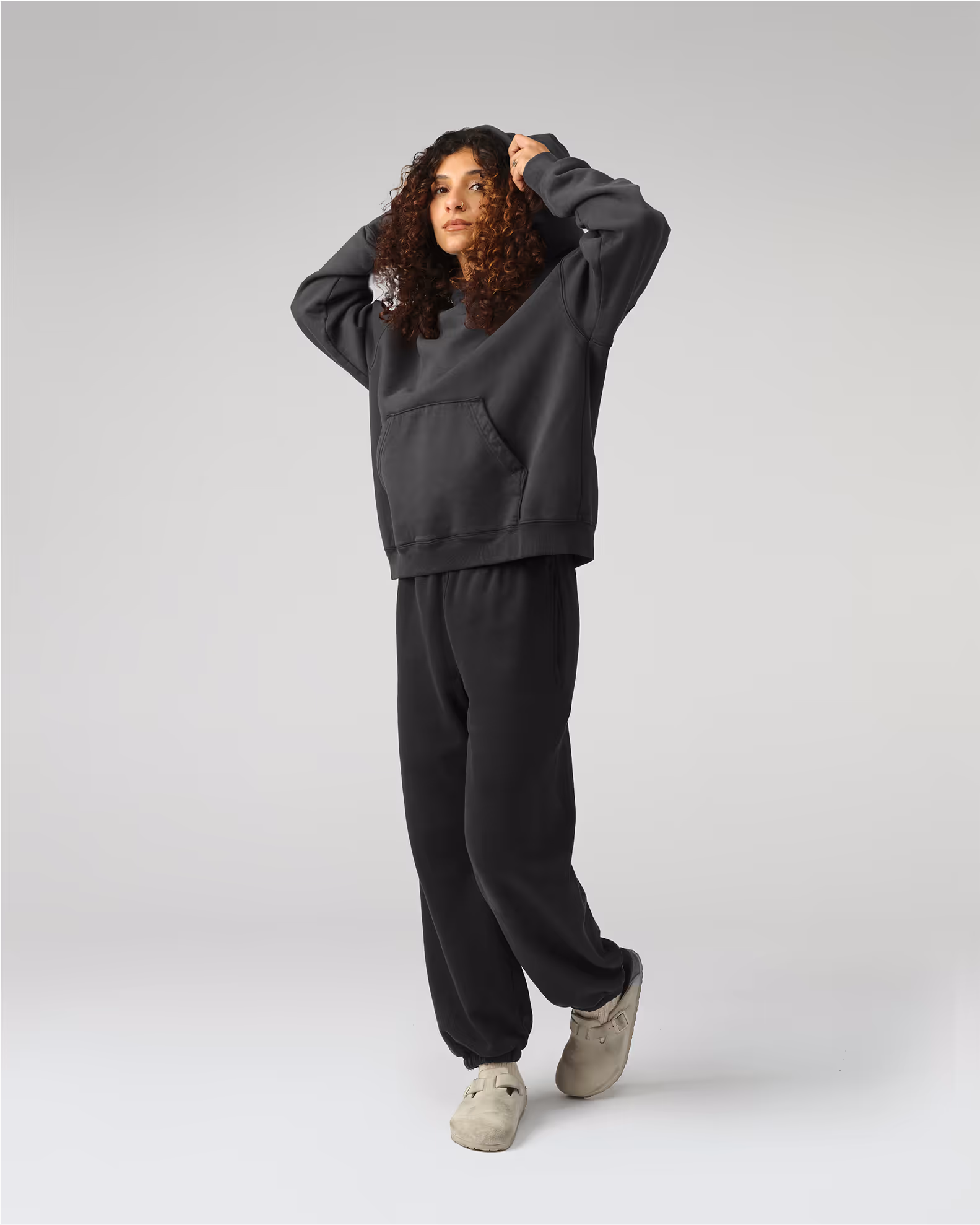 The definitive hoodie silhouette with traditional kangaroo pocket and a modern, relaxed fit. Crafted from our heavyweight organic cotton brushed fleece with an enzyme finish for natural softness.
