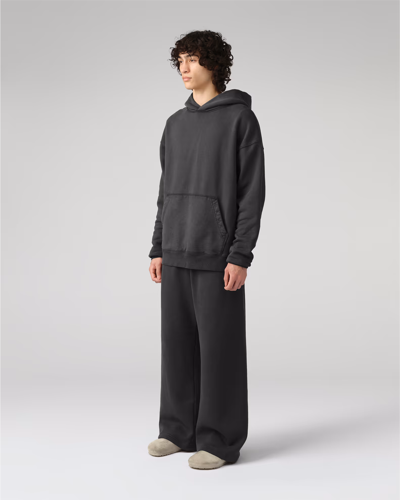 The definitive hoodie silhouette with traditional kangaroo pocket and a modern, relaxed fit. Crafted from our heavyweight organic cotton brushed fleece with an enzyme finish for natural softness.