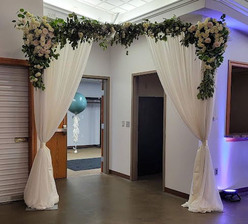 Floral Doorway Framing with white fabric. 