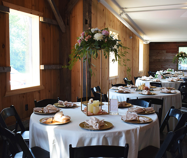 Gold stand with flowers on top. 