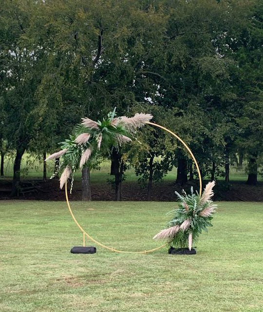 Circular Arch with leaves and feathers.
