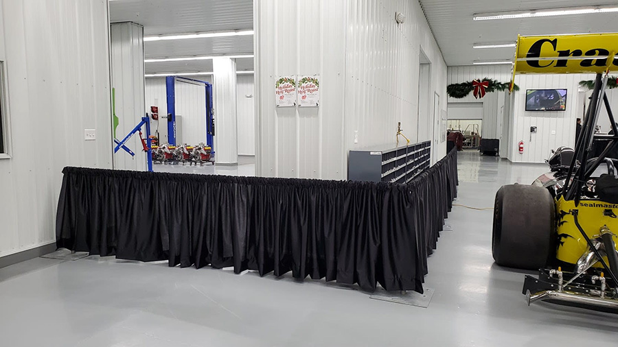 Mini wall draping for blocking off areas without blocking the view. 