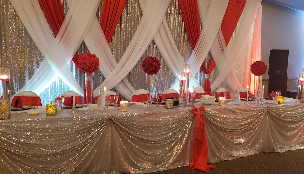 Red and Gold Backdrop with gold sequin table linen. 