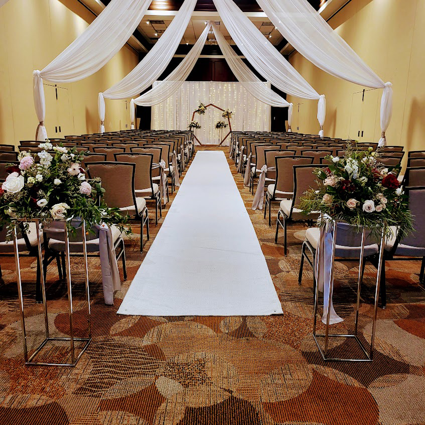 Ceiling draping with arch and backdrop.