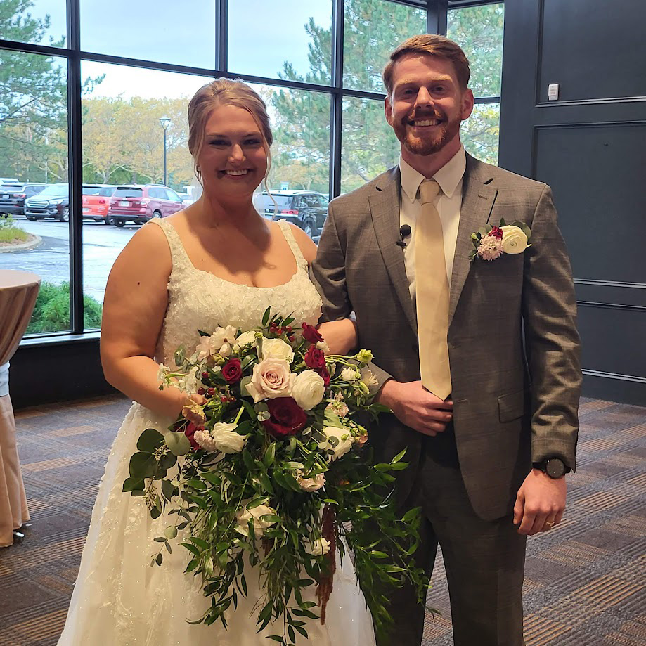 Bride and Groom with bouquet and boutonniere. 