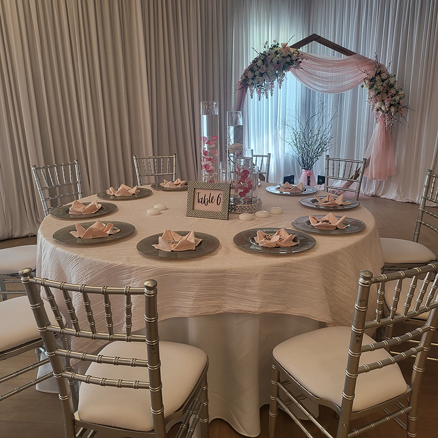 Gideon Owen wedding design with backdrop and table decorations.