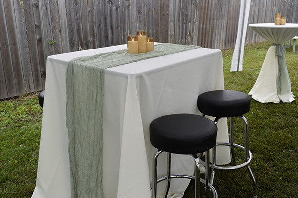 White linen with sage table runner.