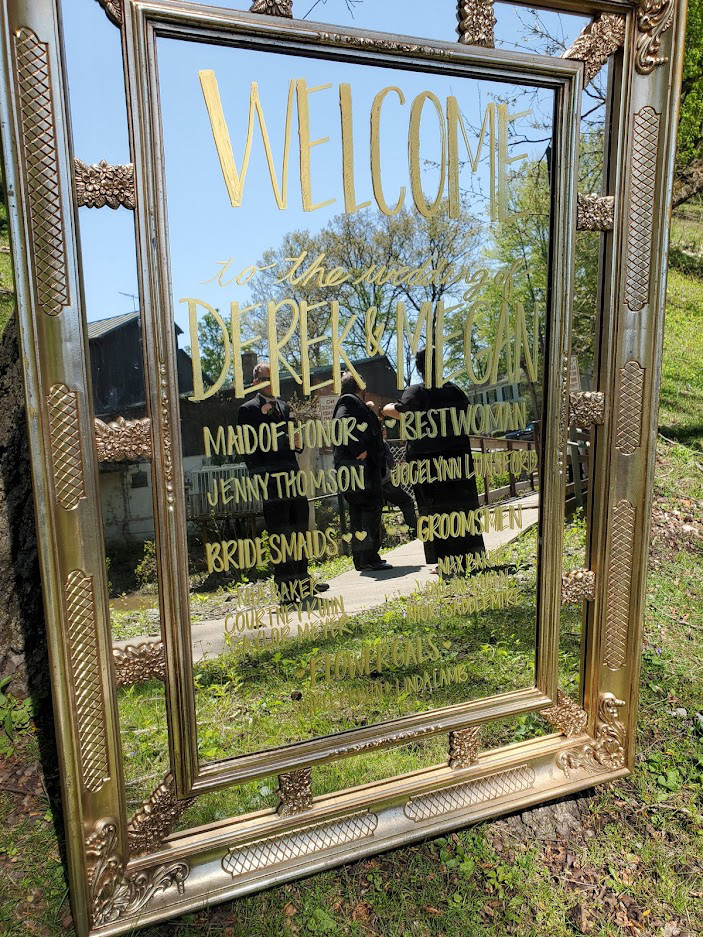 Gold Mirror with gold words on it. 