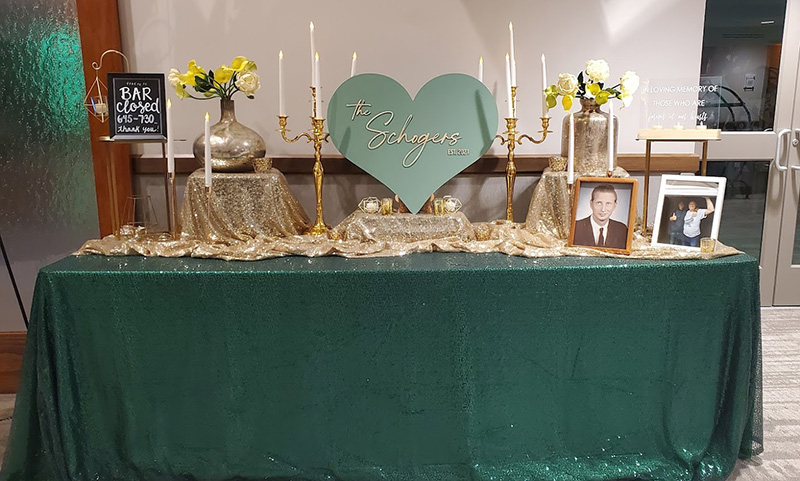 Green sequin linen for a memory table at a wedding.