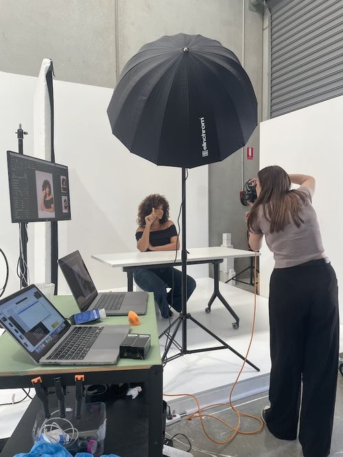 Lifestyle photo of model with beauty product in studio