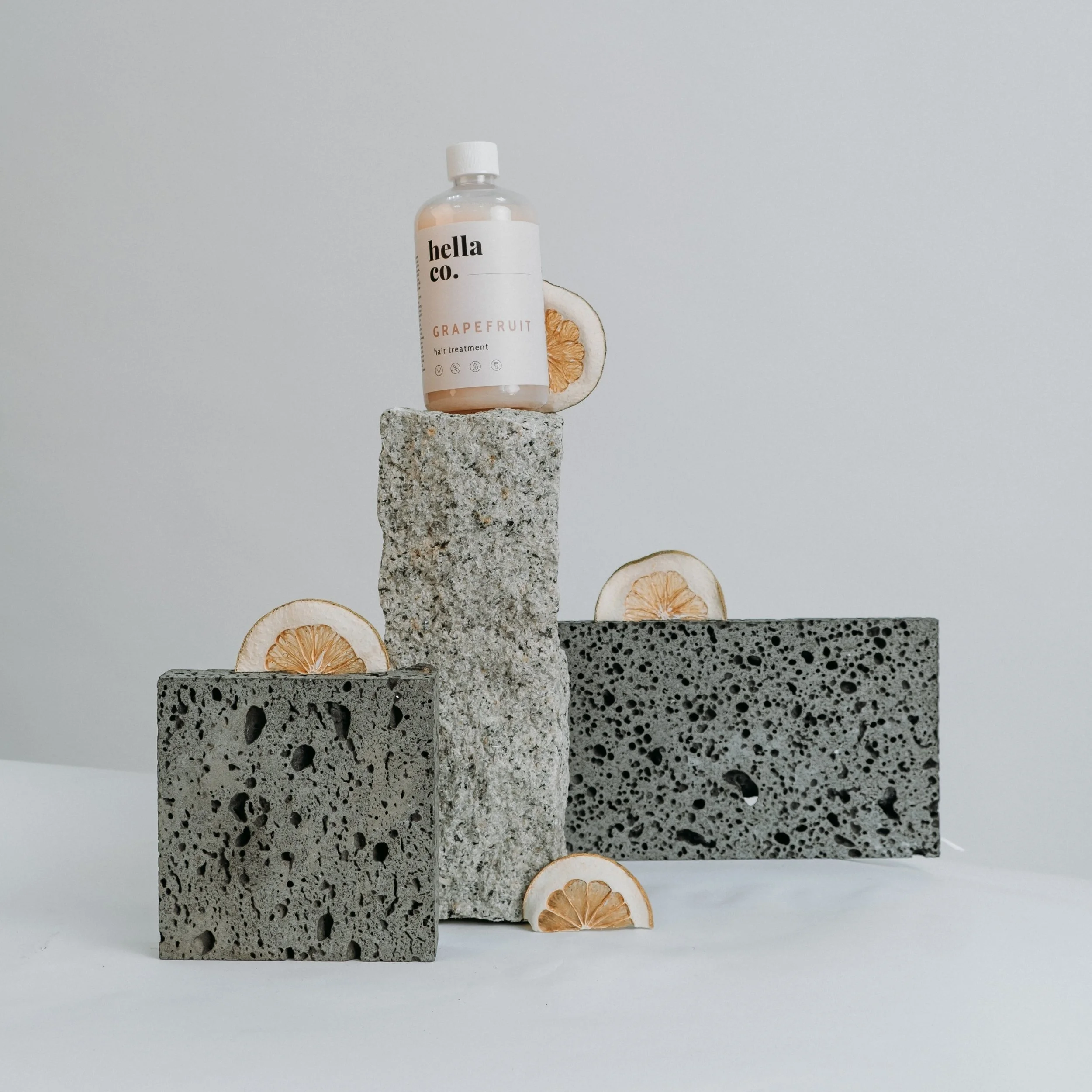 Lifestyle photo of model with beauty product in studio