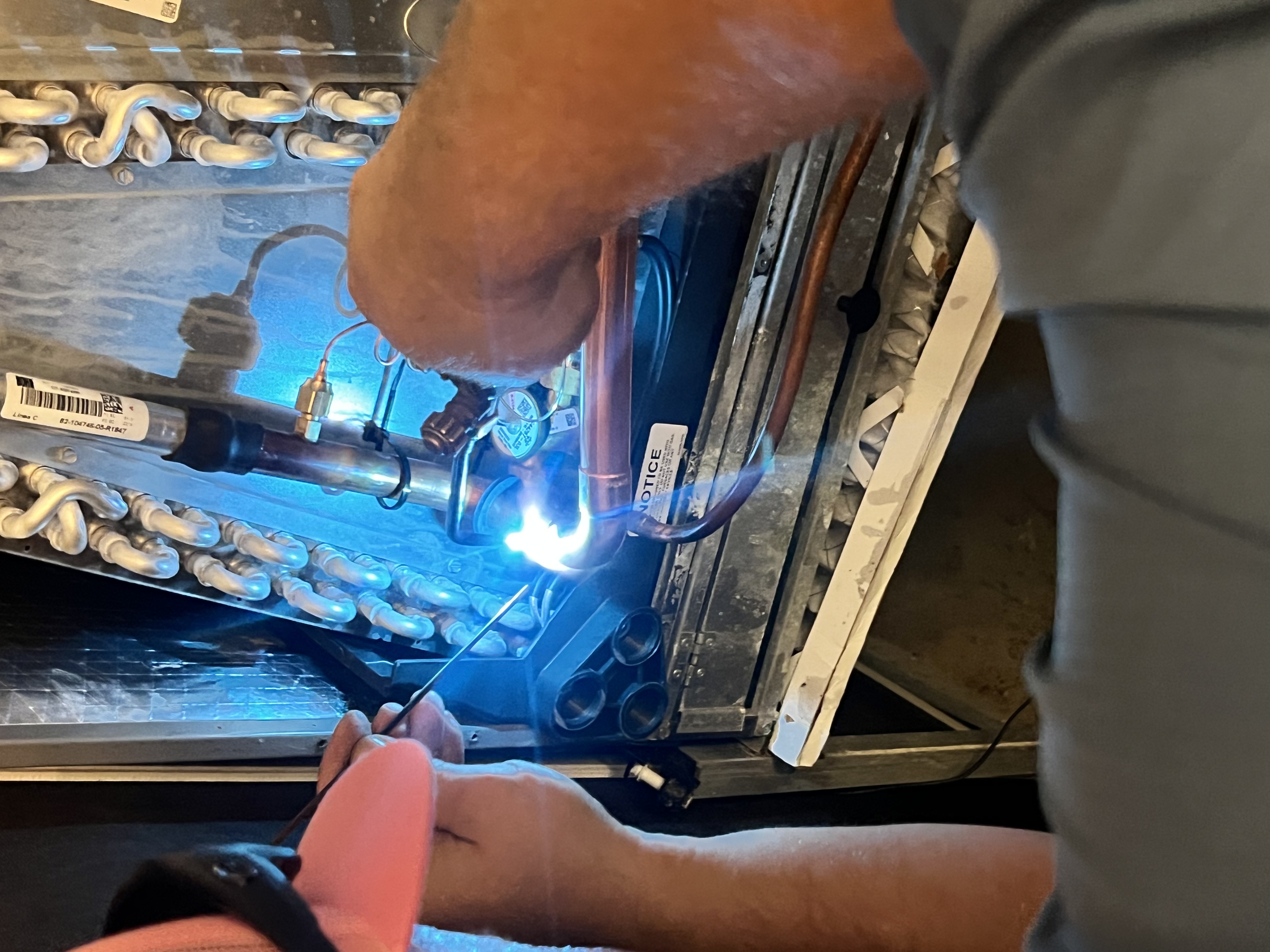 technician working on hvac maintenance