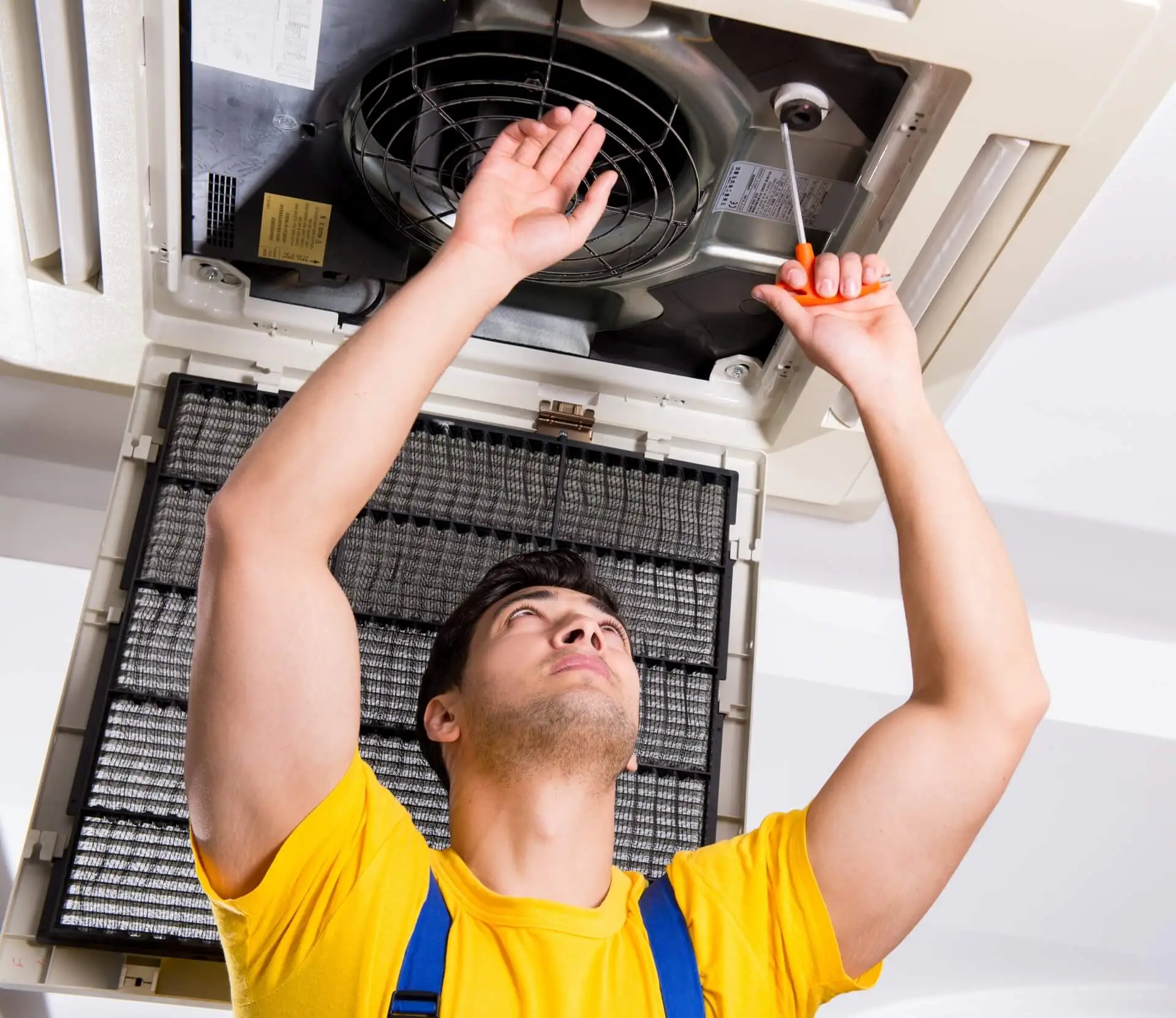technician repairing an air duct