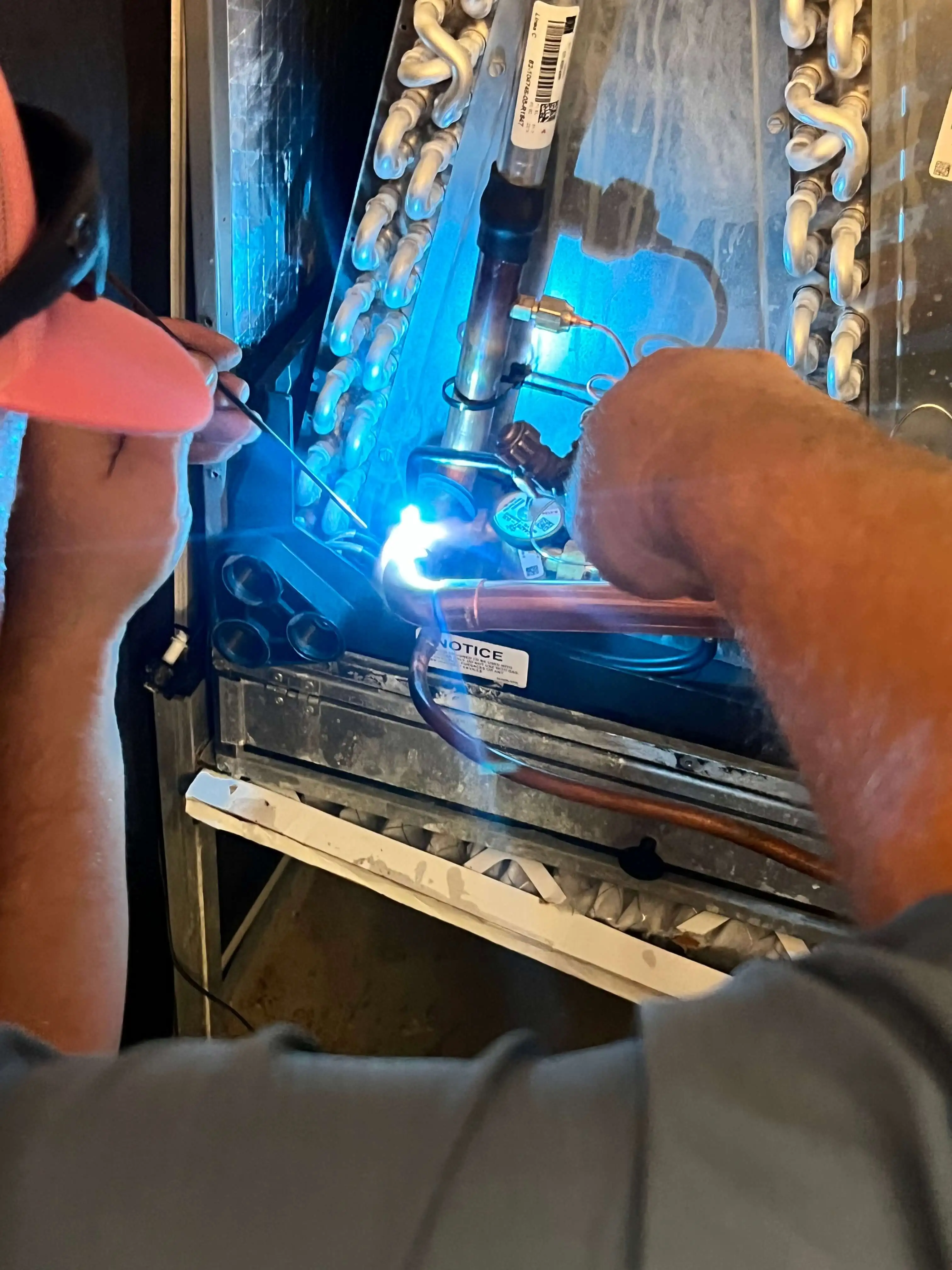 technician working on hvac maintenance