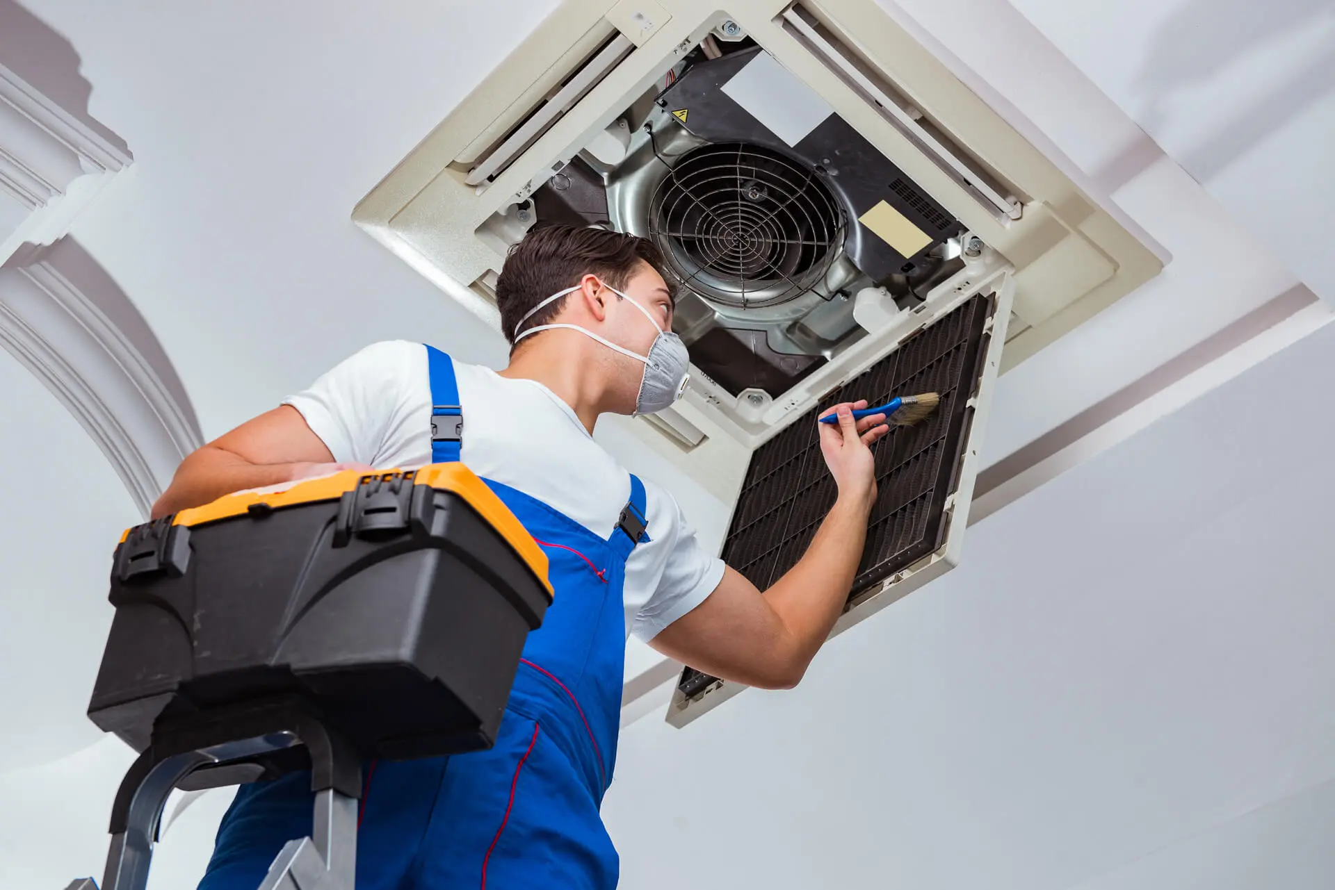 hvac technician sealing an air duct