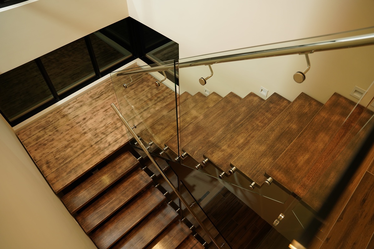 Timber staircase with frameless glass balustrade