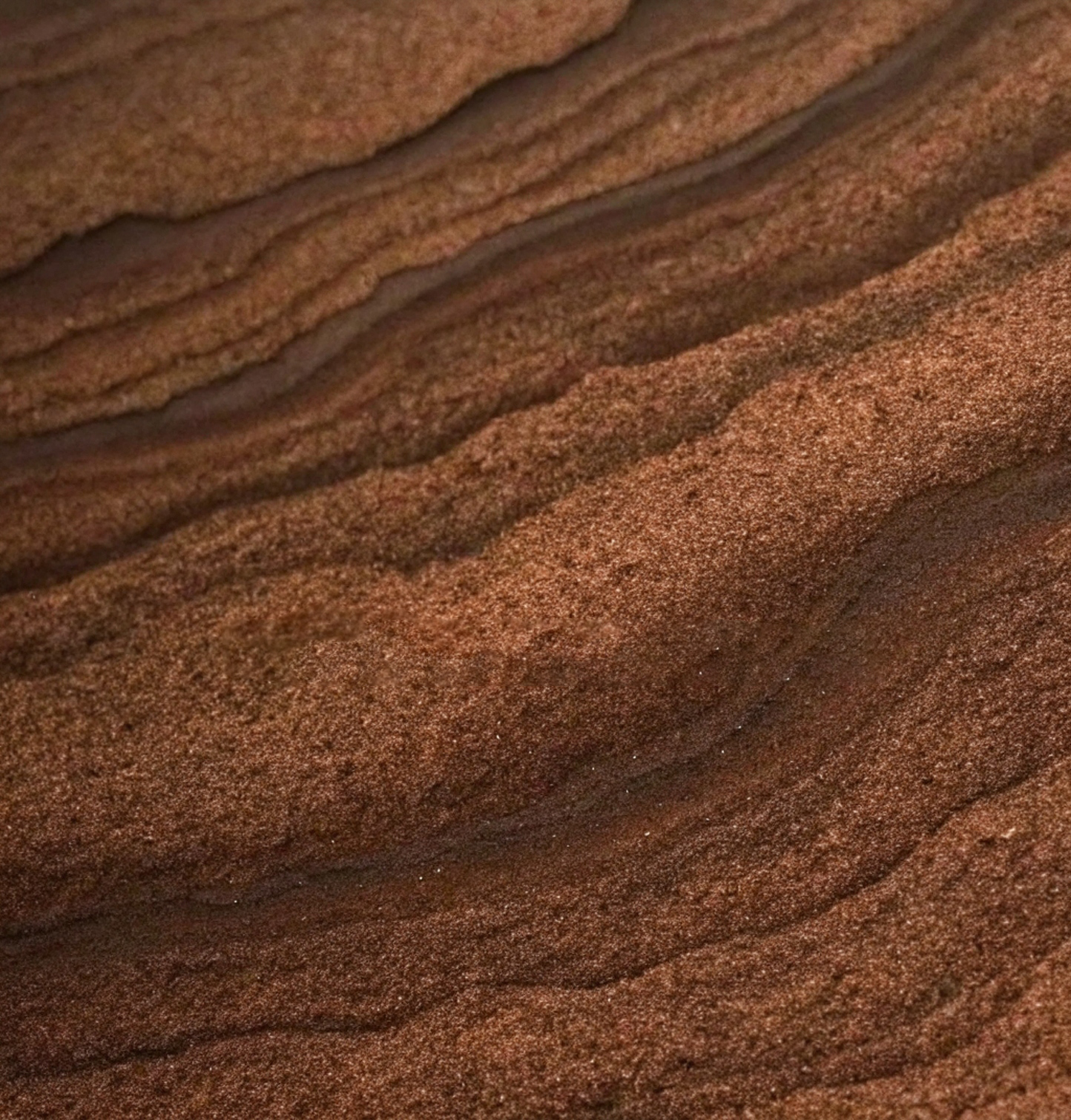 Texture of deep brown sand