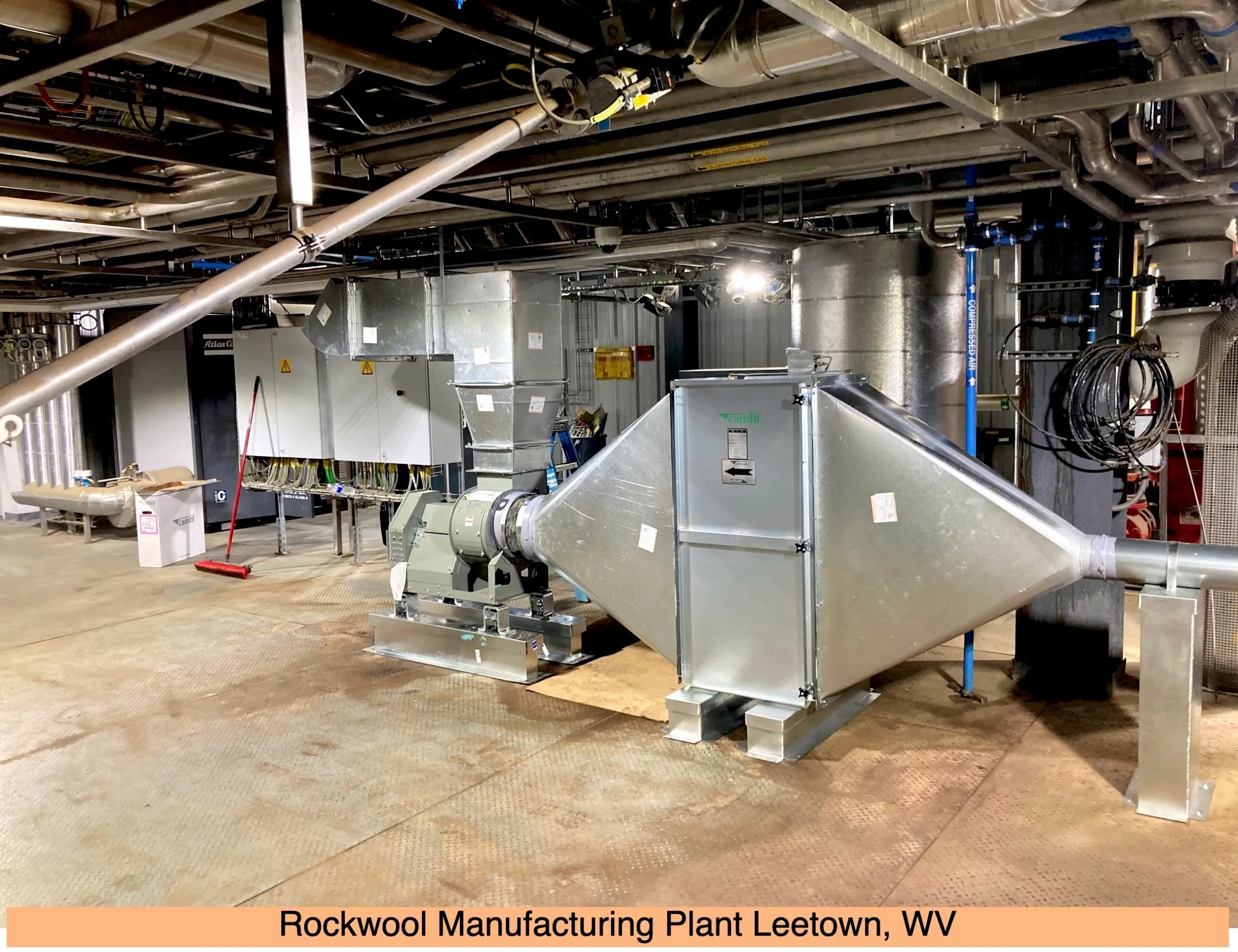 Industrial machinery and ductwork inside Rockwool manufacturing plant