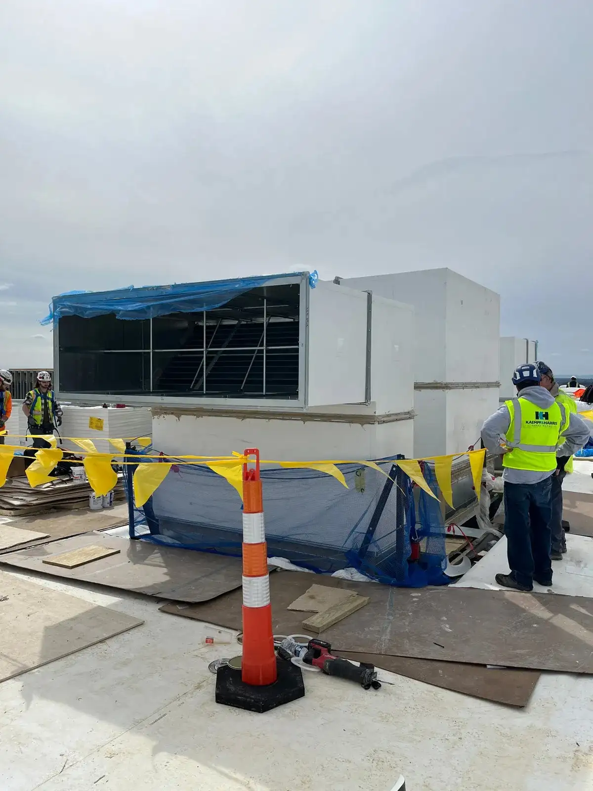A rooftop air conditioning unit with caution tape.