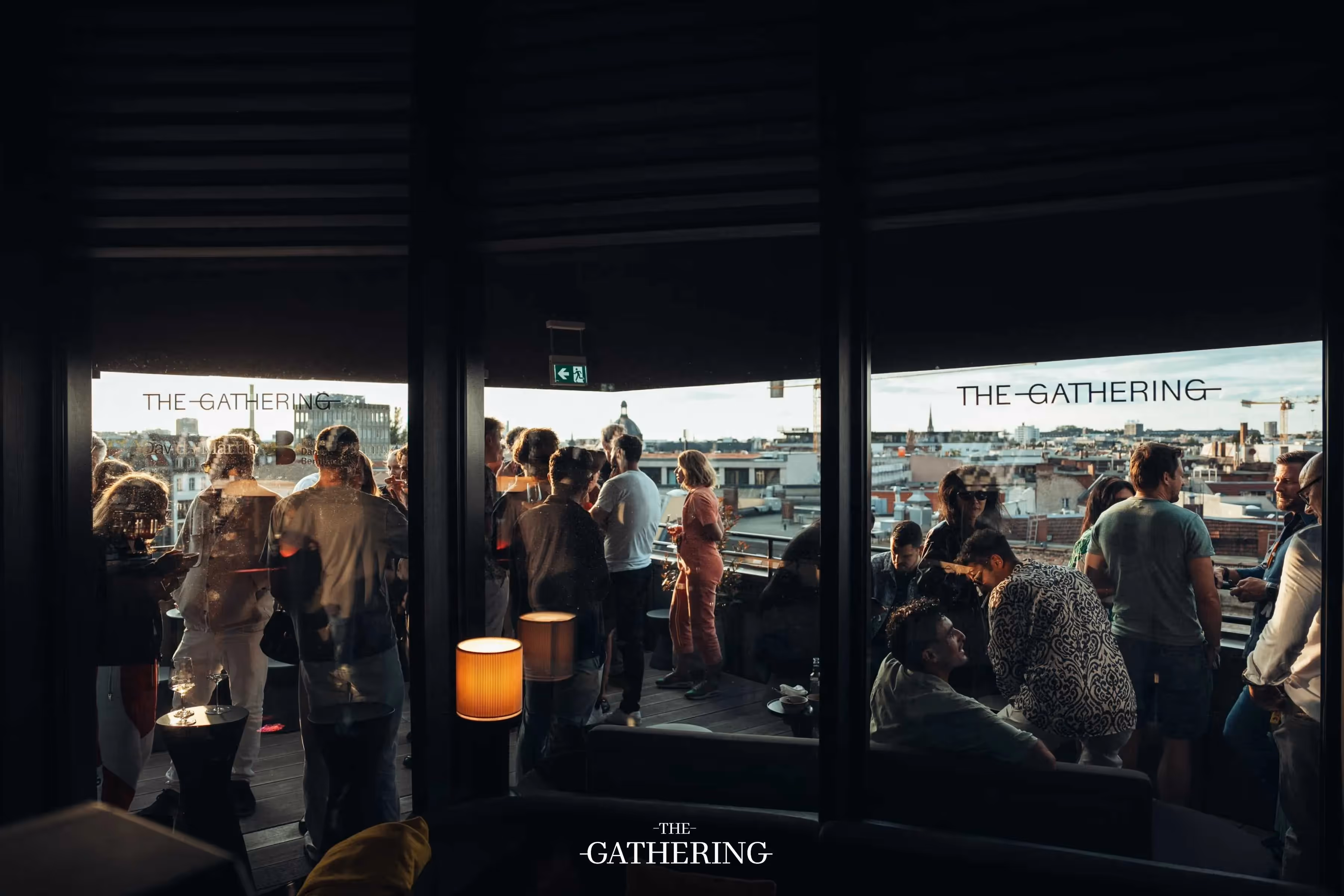 Crowd mingling with drinks at The Gathering hosted by Maison ACME