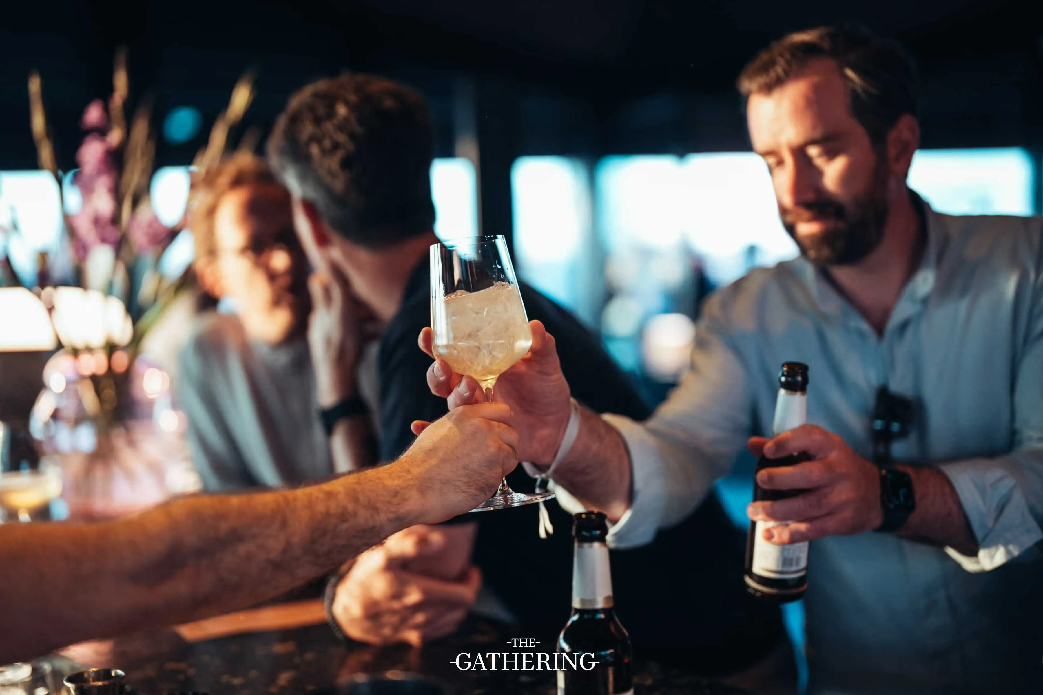 Crowd mingling with drinks at The Gathering hosted by Maison ACME