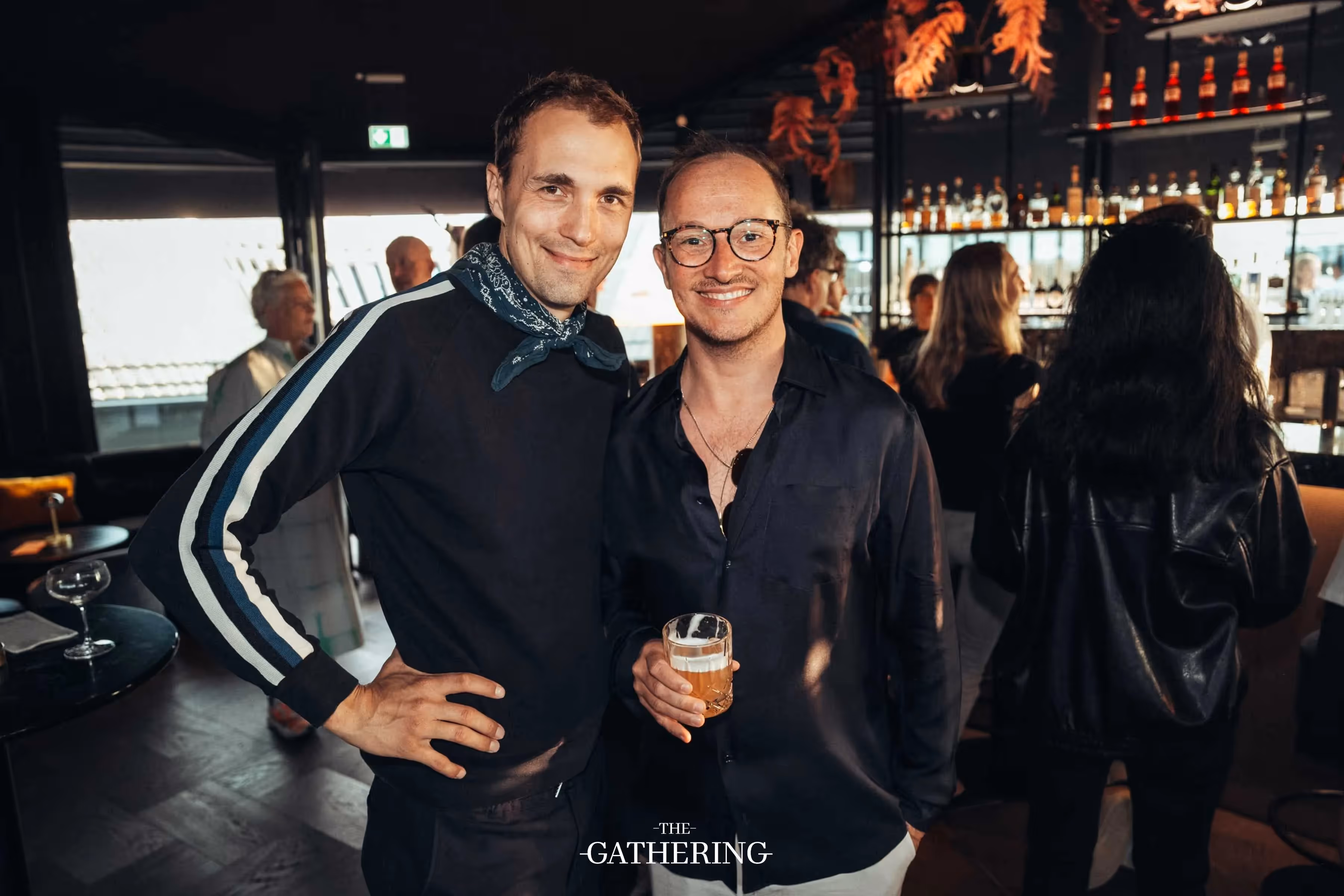 Crowd mingling with drinks at The Gathering hosted by Maison ACME