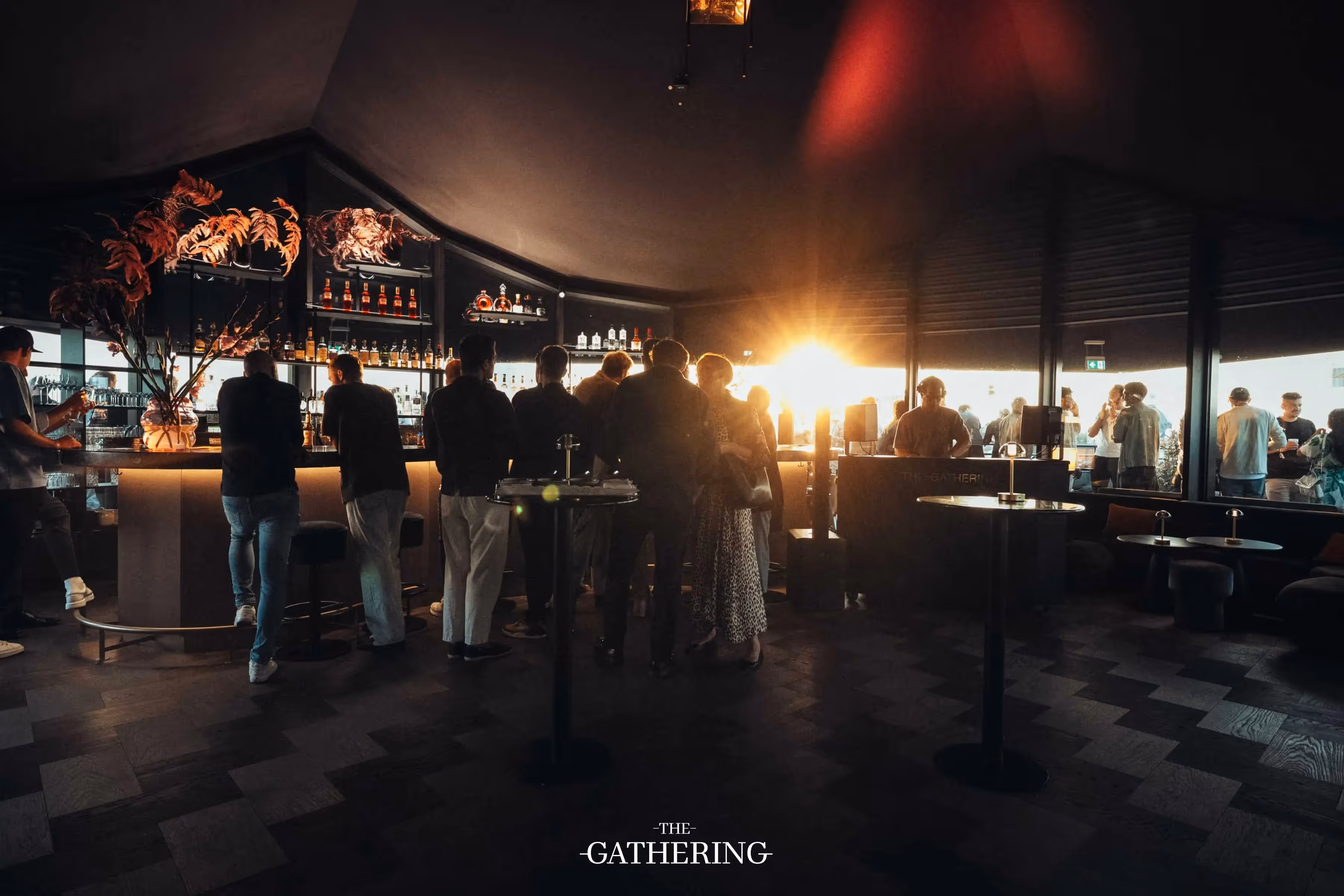 Crowd mingling with drinks at The Gathering hosted by Maison ACME