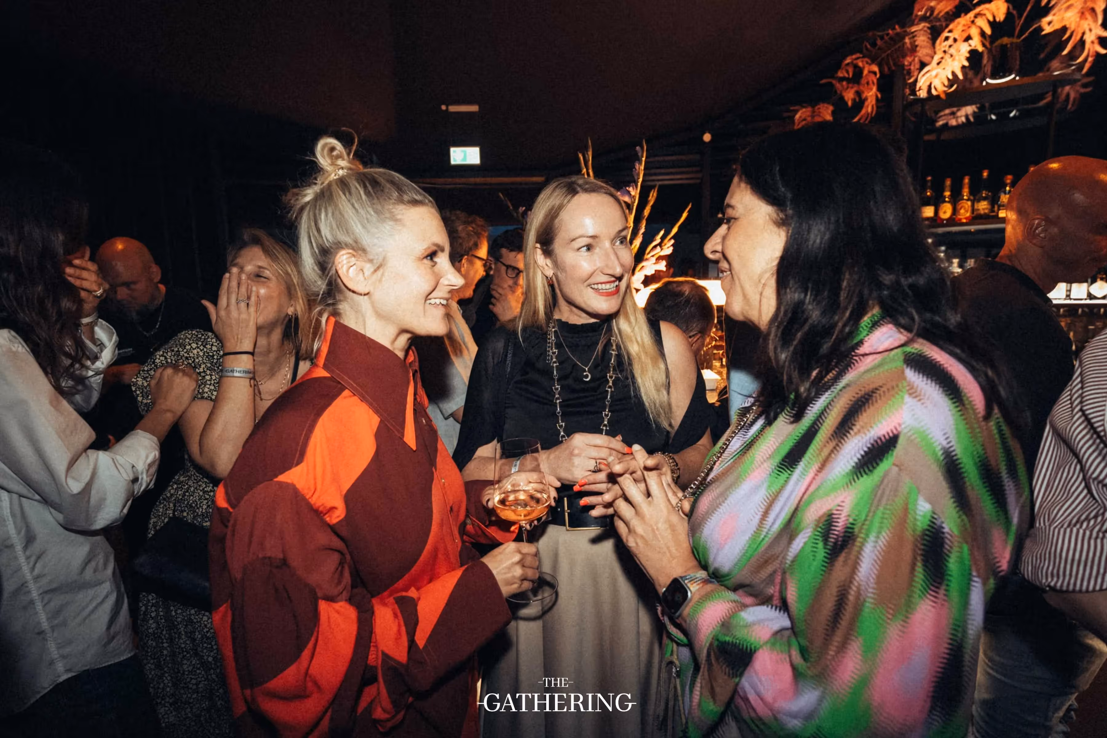 Crowd mingling with drinks at The Gathering hosted by Maison ACME