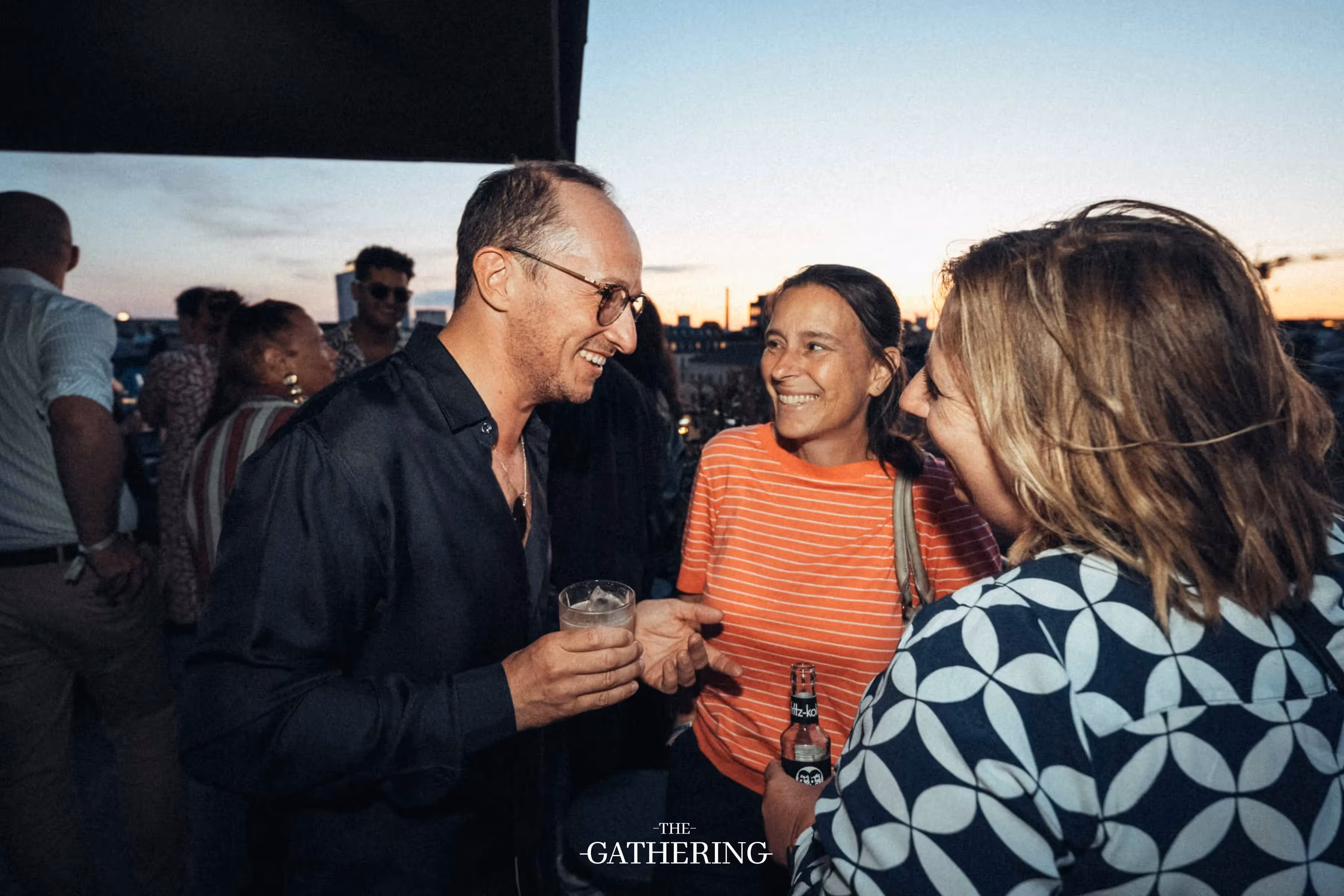Crowd mingling with drinks at The Gathering hosted by Maison ACME