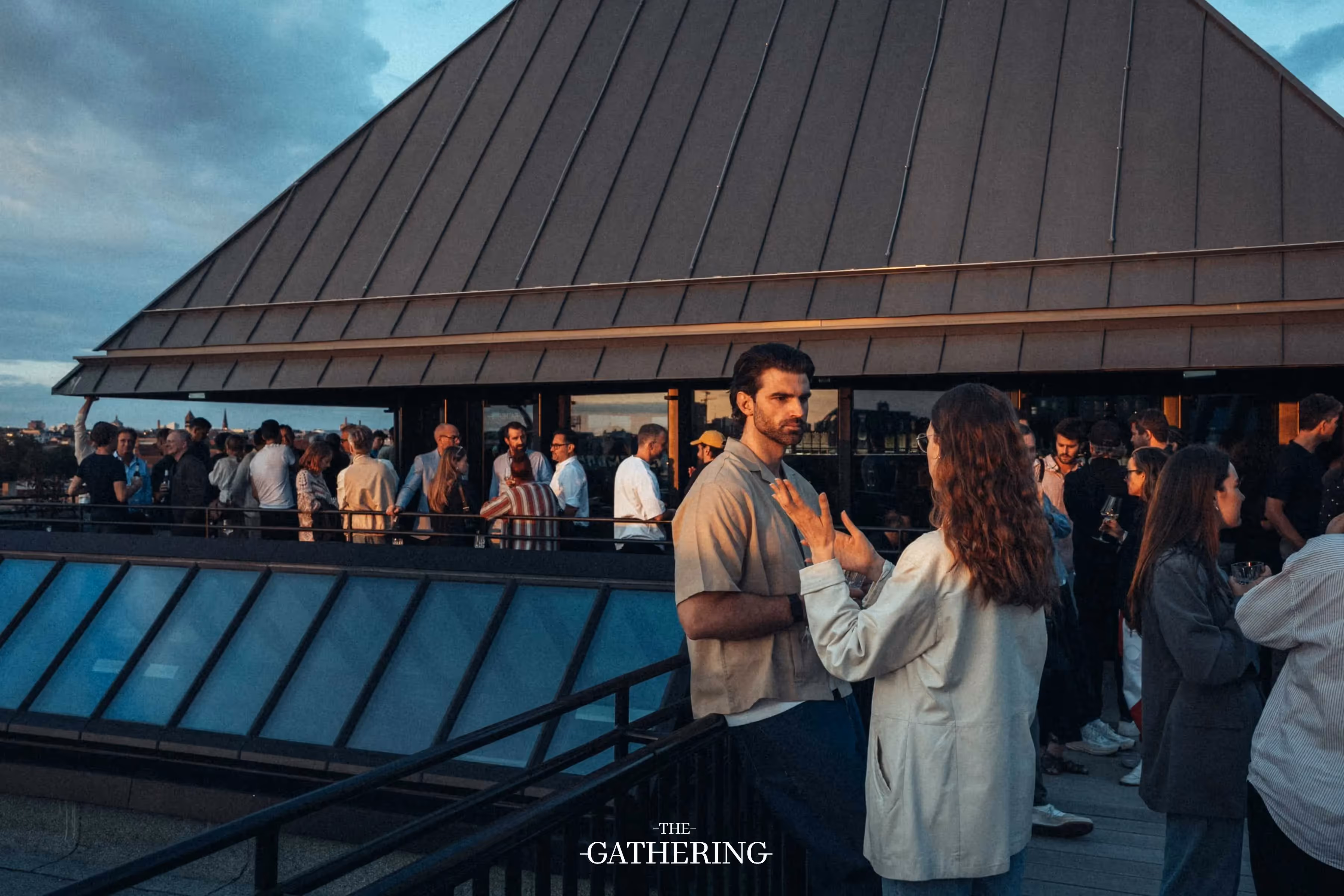 Crowd mingling with drinks at The Gathering hosted by Maison ACME