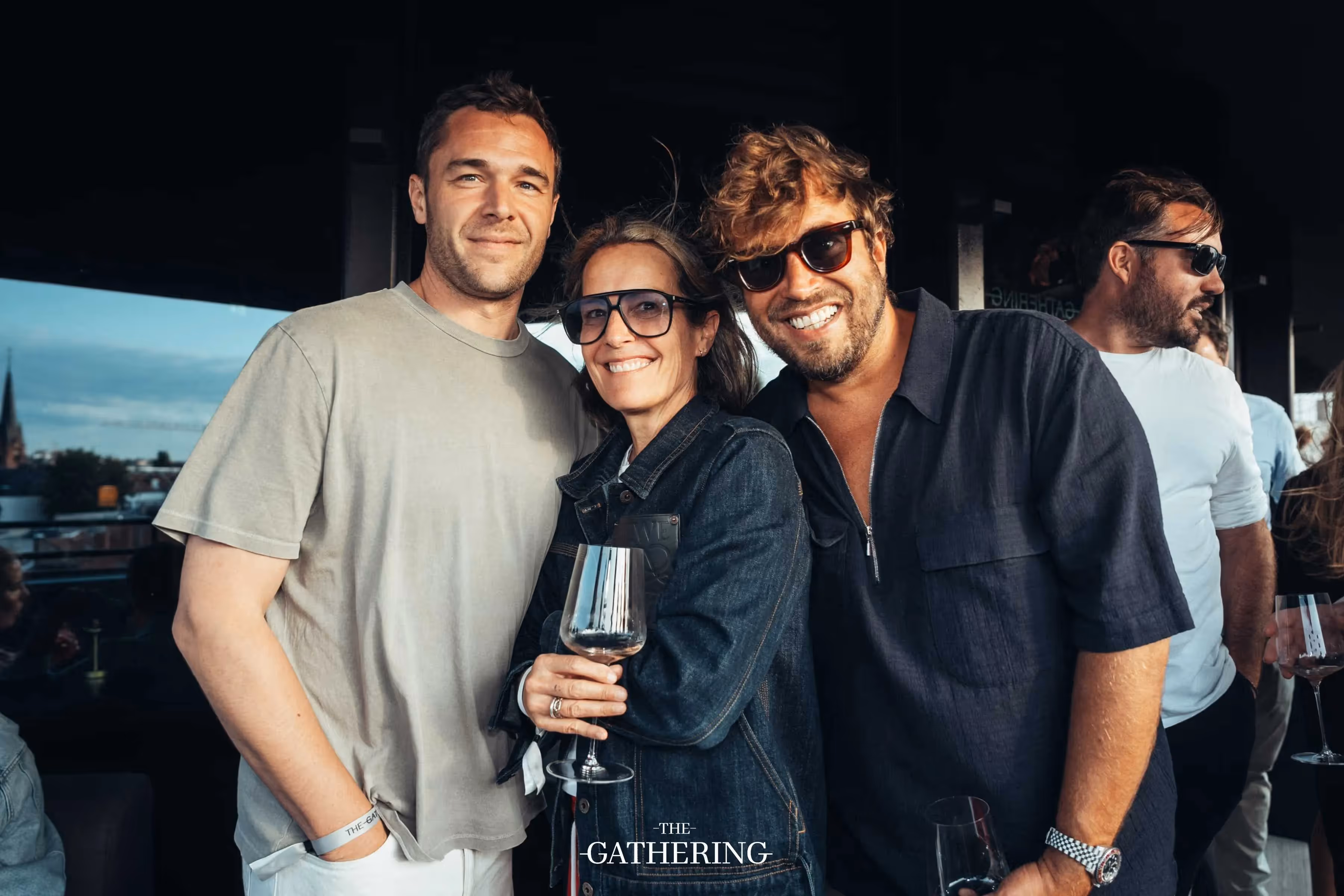 Crowd mingling with drinks at The Gathering hosted by Maison ACME