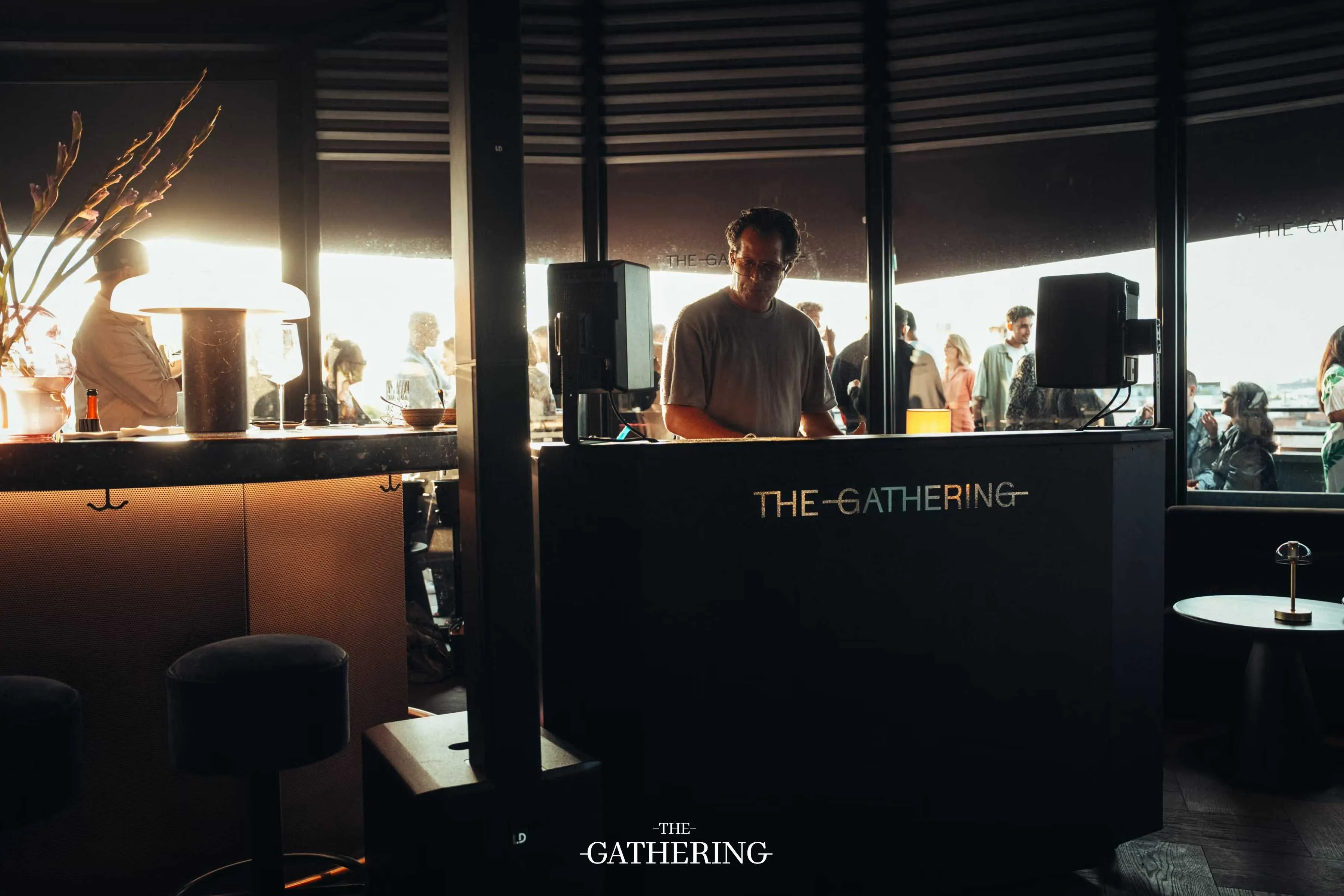 Crowd mingling with drinks at The Gathering hosted by Maison ACME