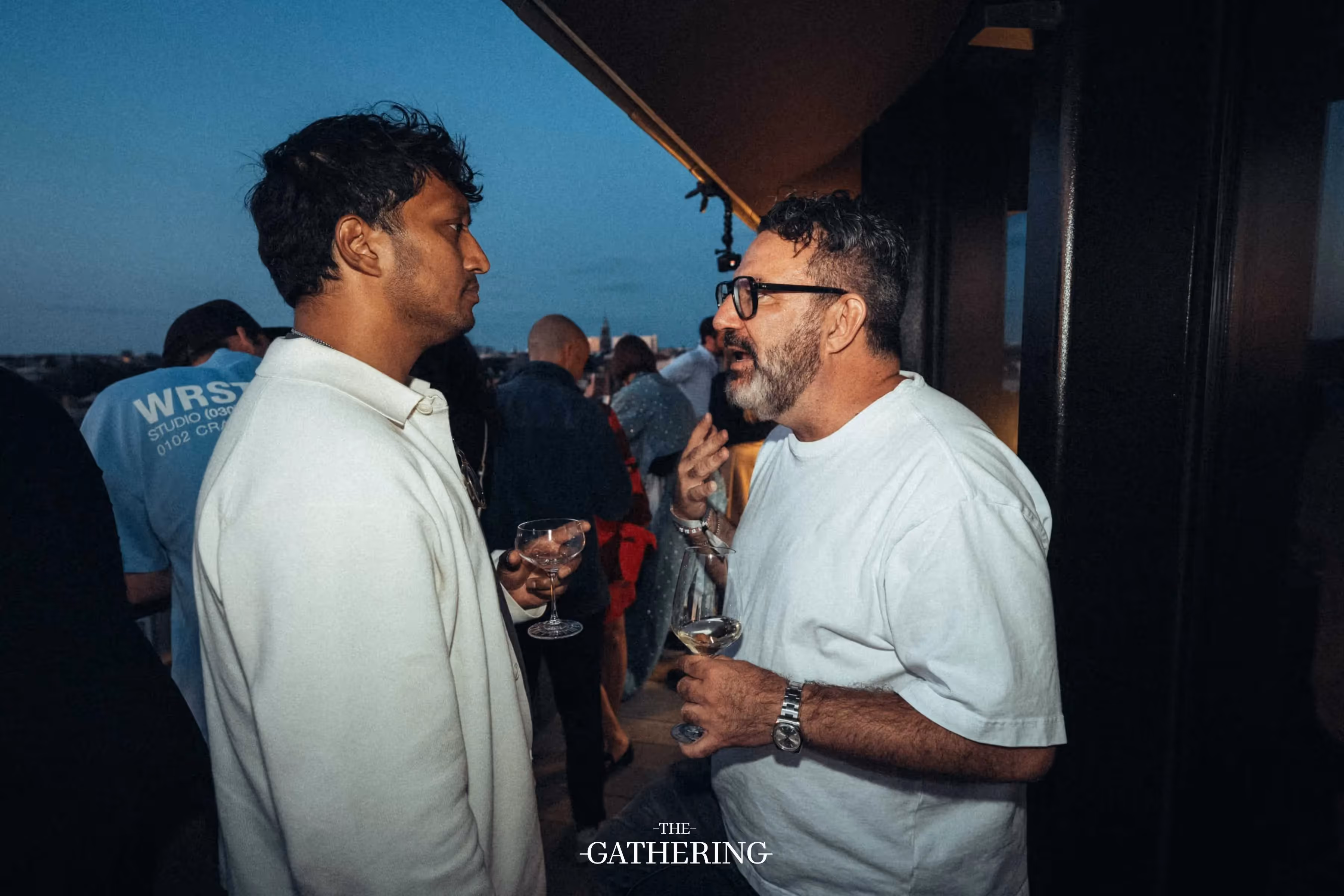 Crowd mingling with drinks at The Gathering hosted by Maison ACME