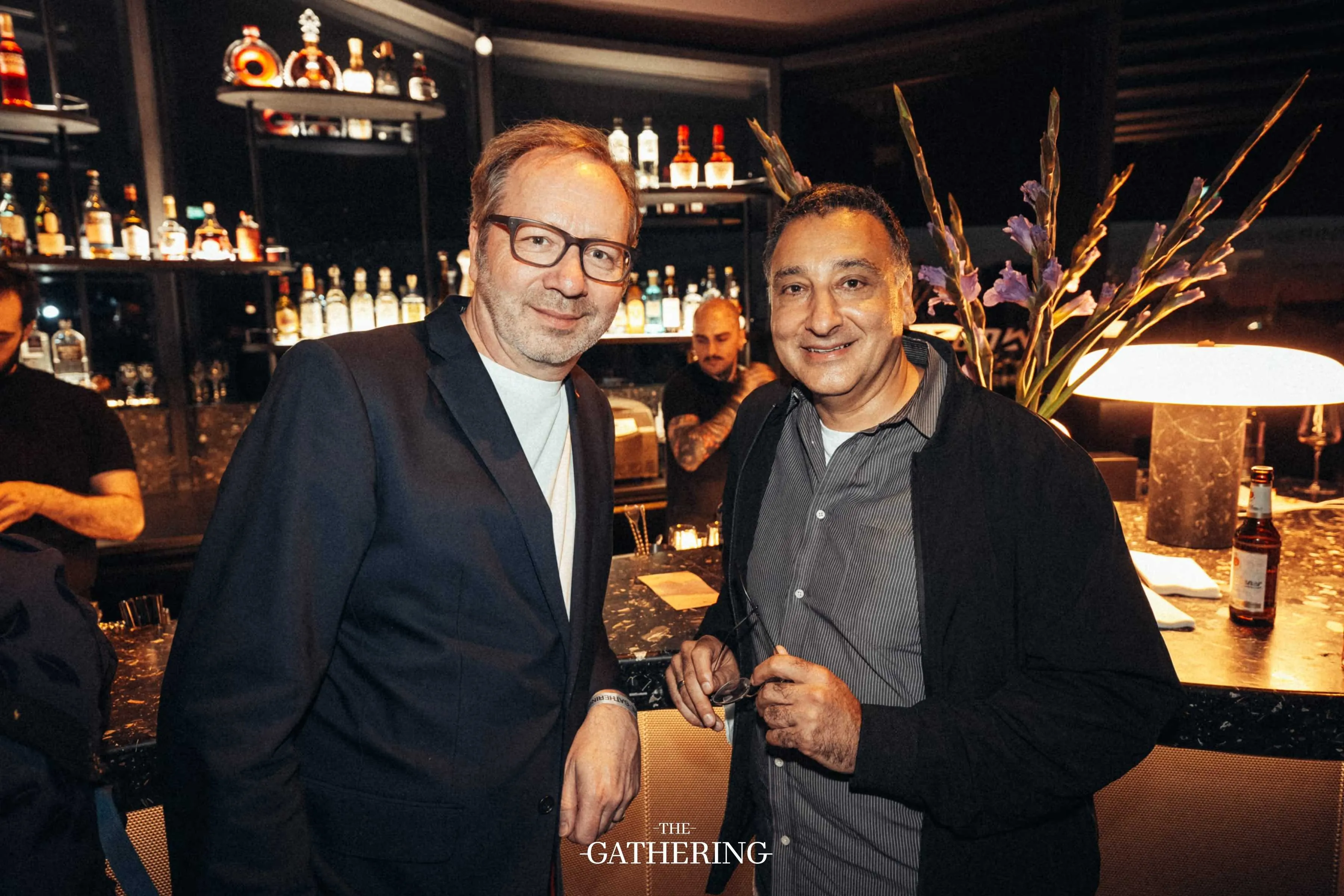 Crowd mingling with drinks at The Gathering hosted by Maison ACME