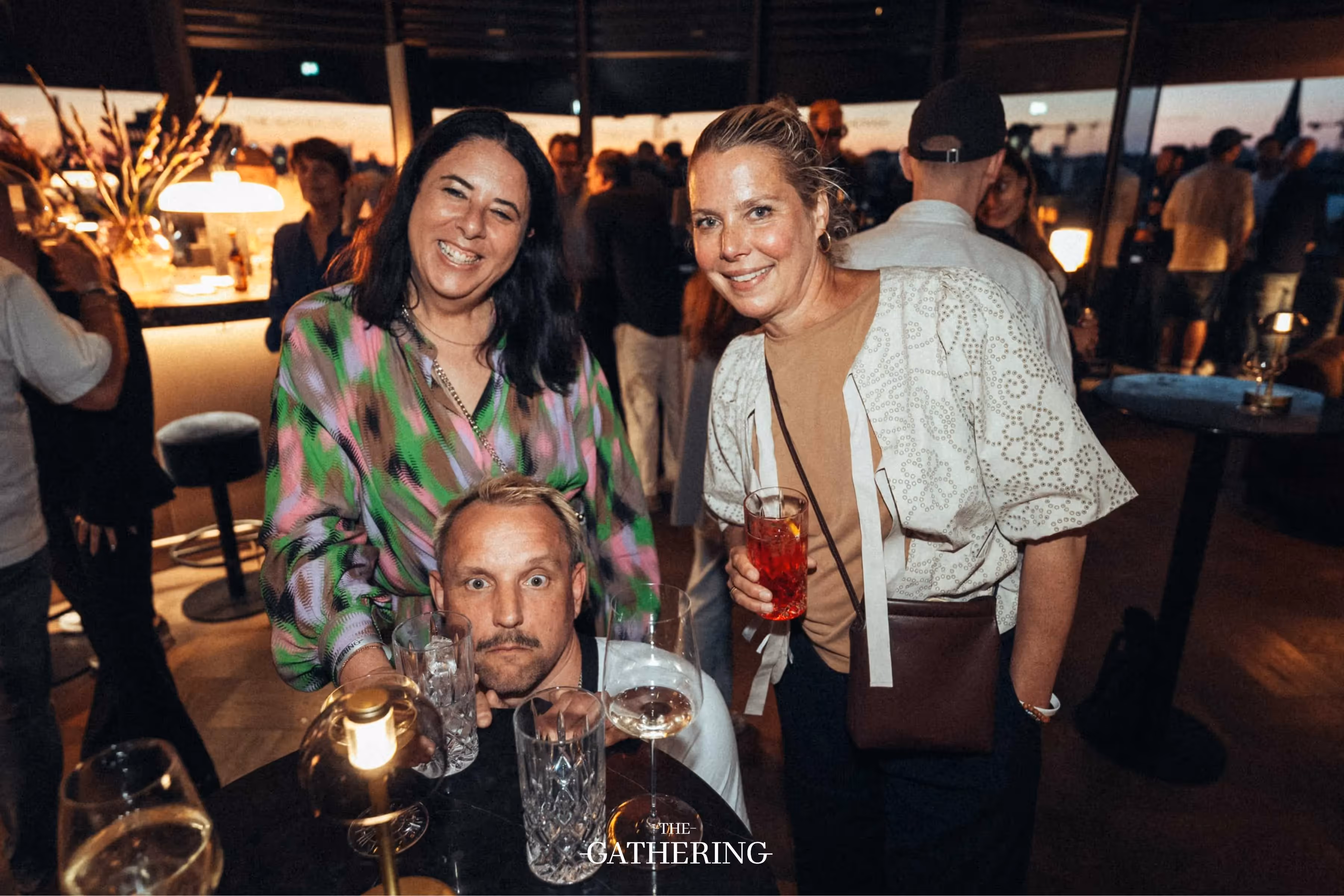 Crowd mingling with drinks at The Gathering hosted by Maison ACME
