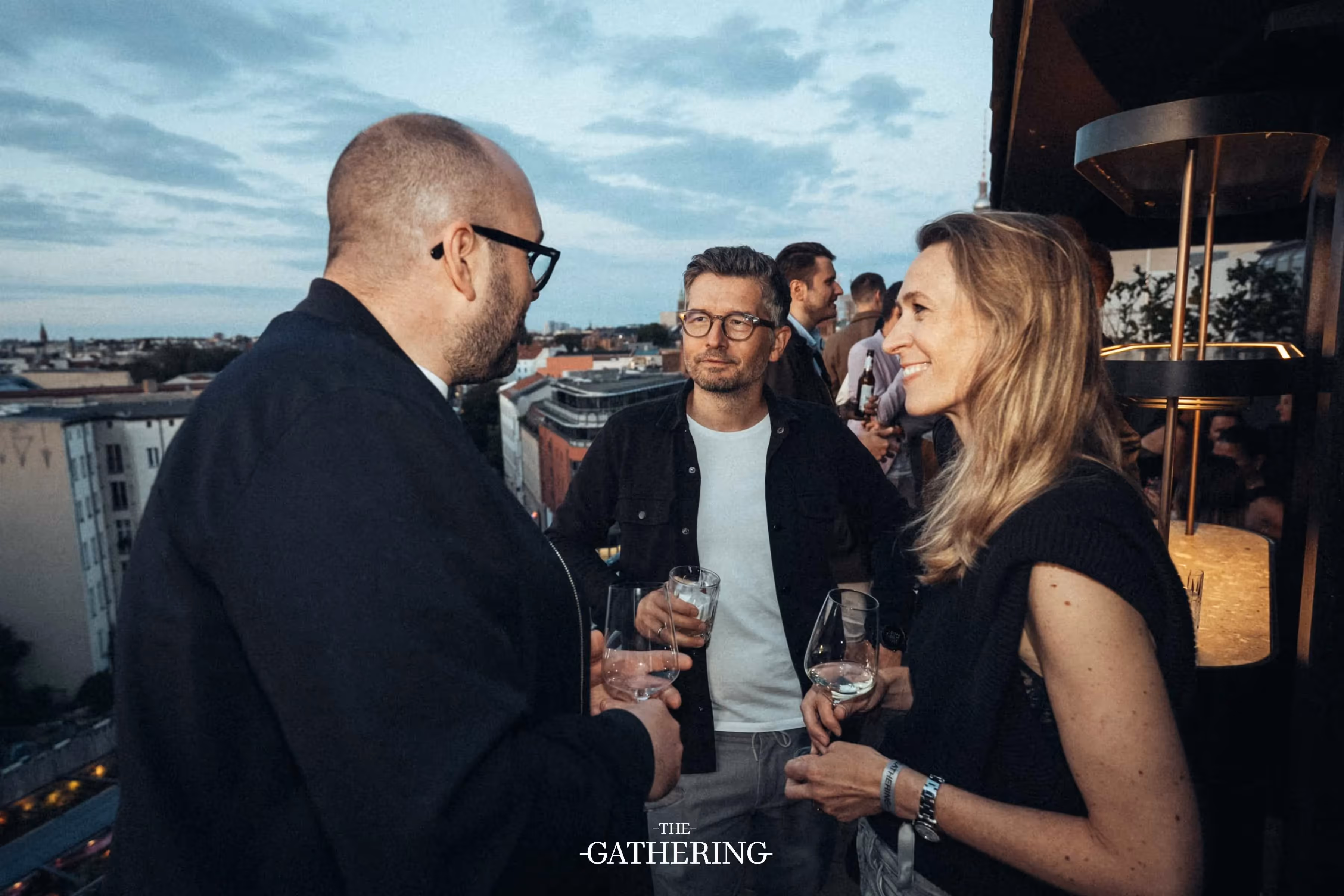 Crowd mingling with drinks at The Gathering hosted by Maison ACME