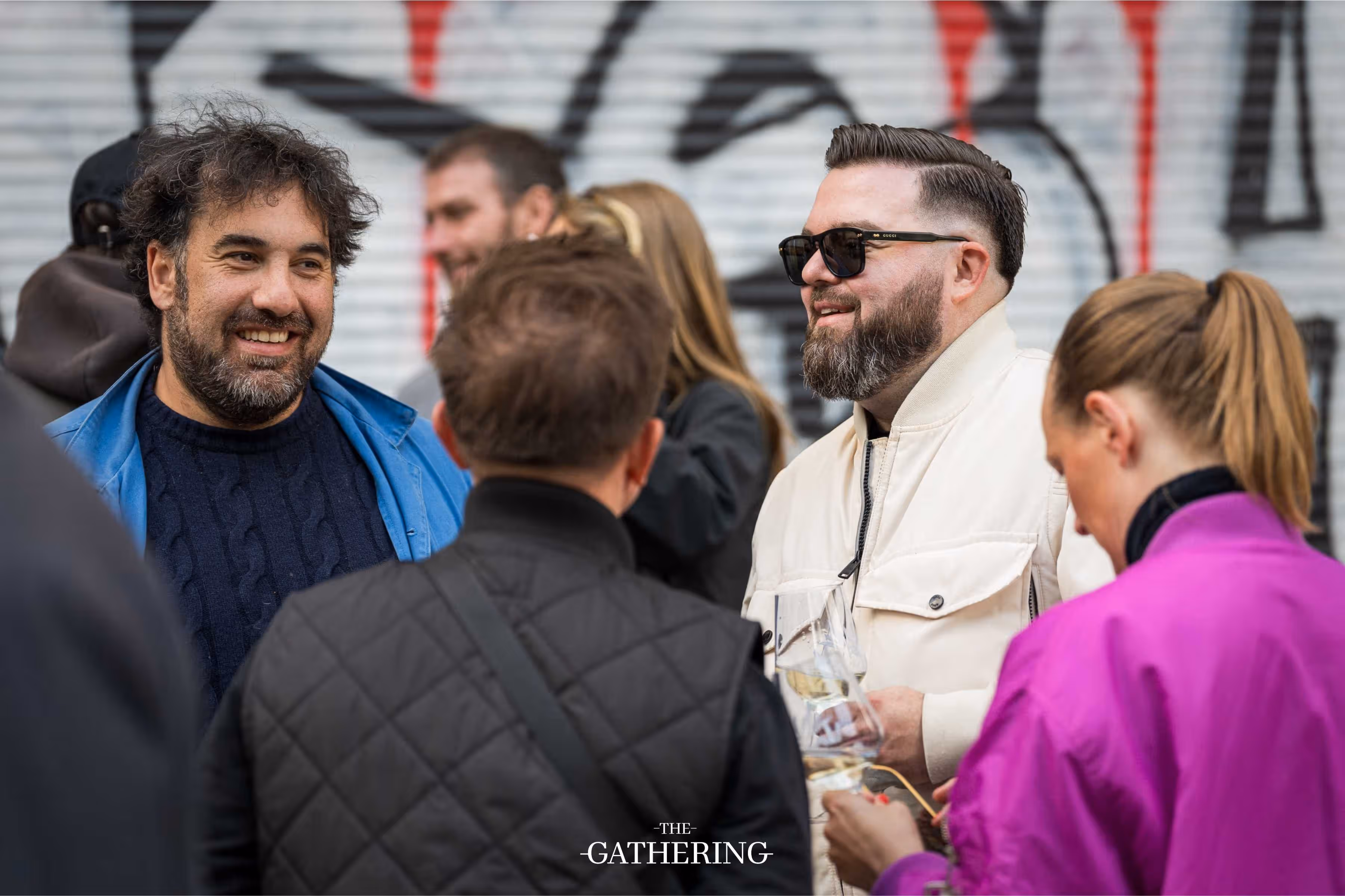 Crowd mingling with drinks at The Gathering hosted by Maison ACME